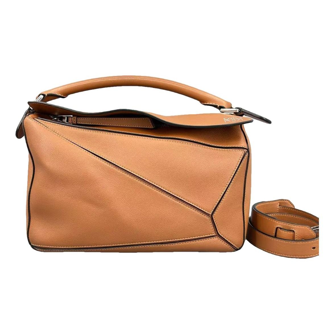 Puzzle leather handbag