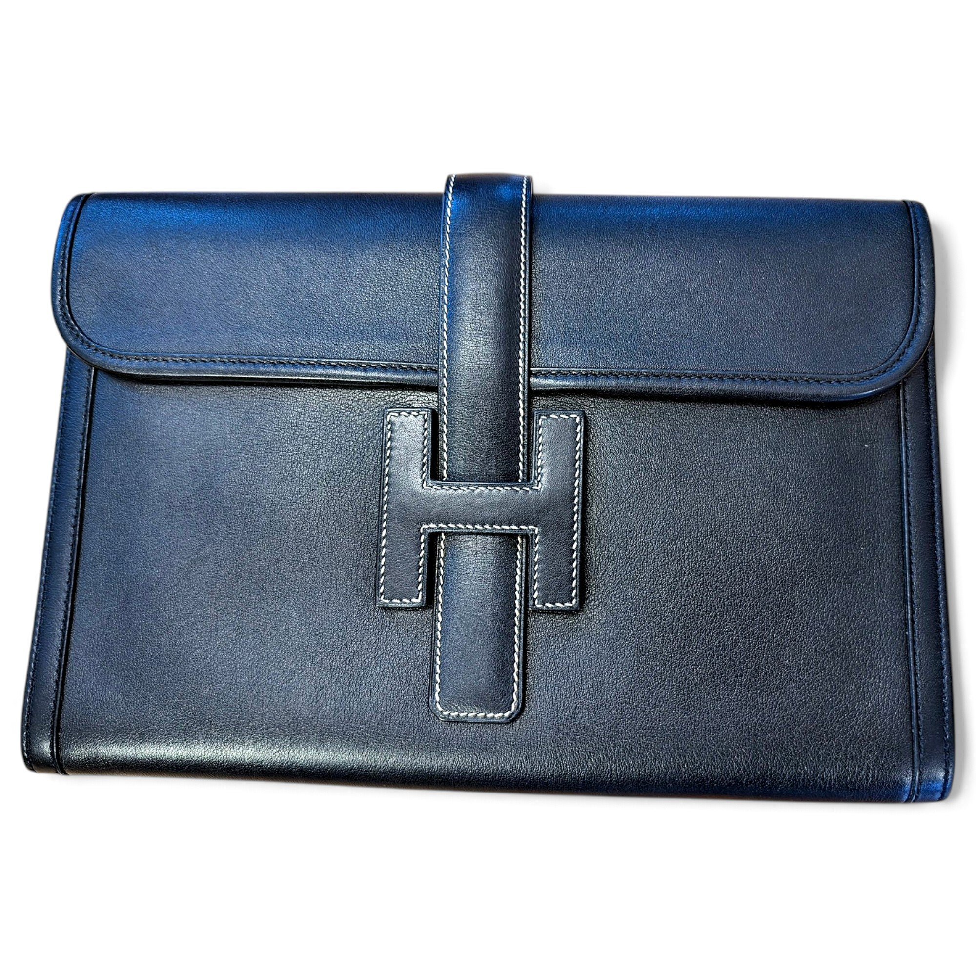 Jige leather clutch bag