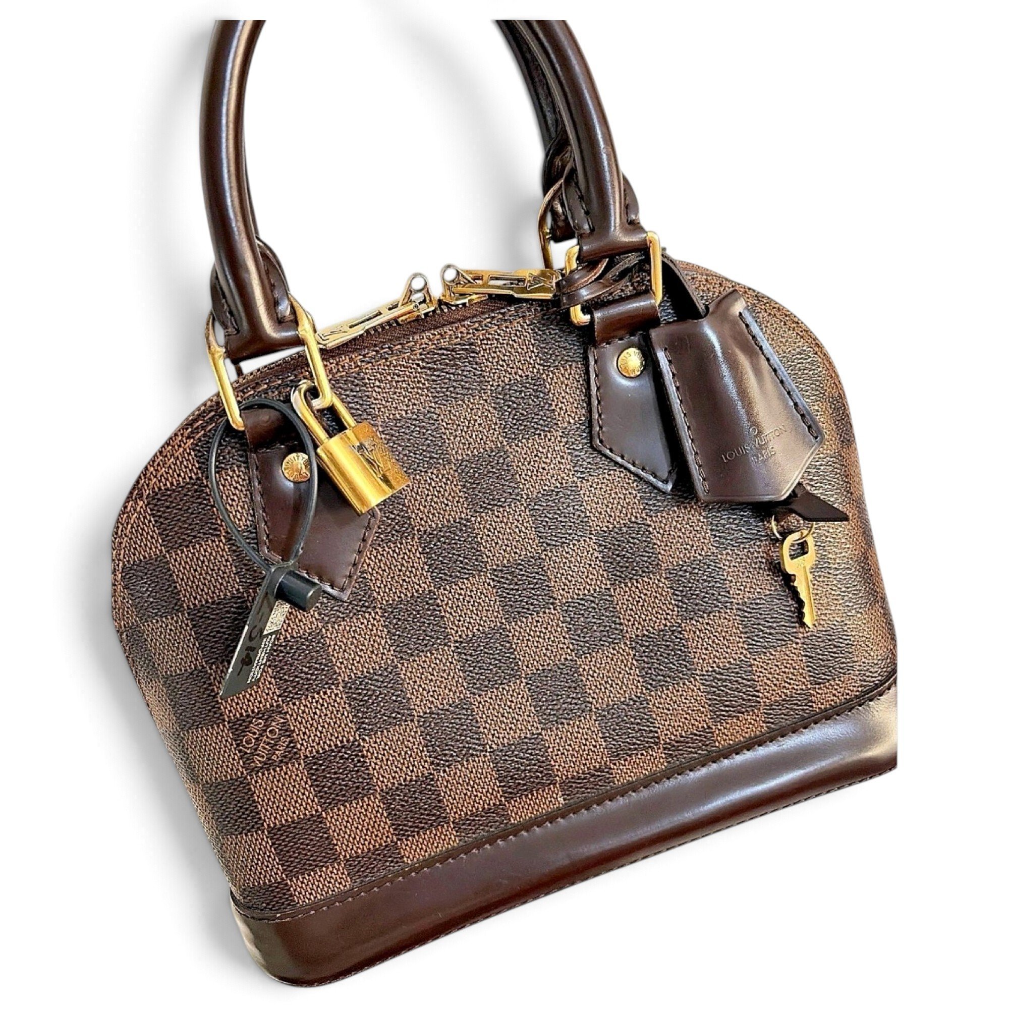 Louis Vuitton Alma leather handbag