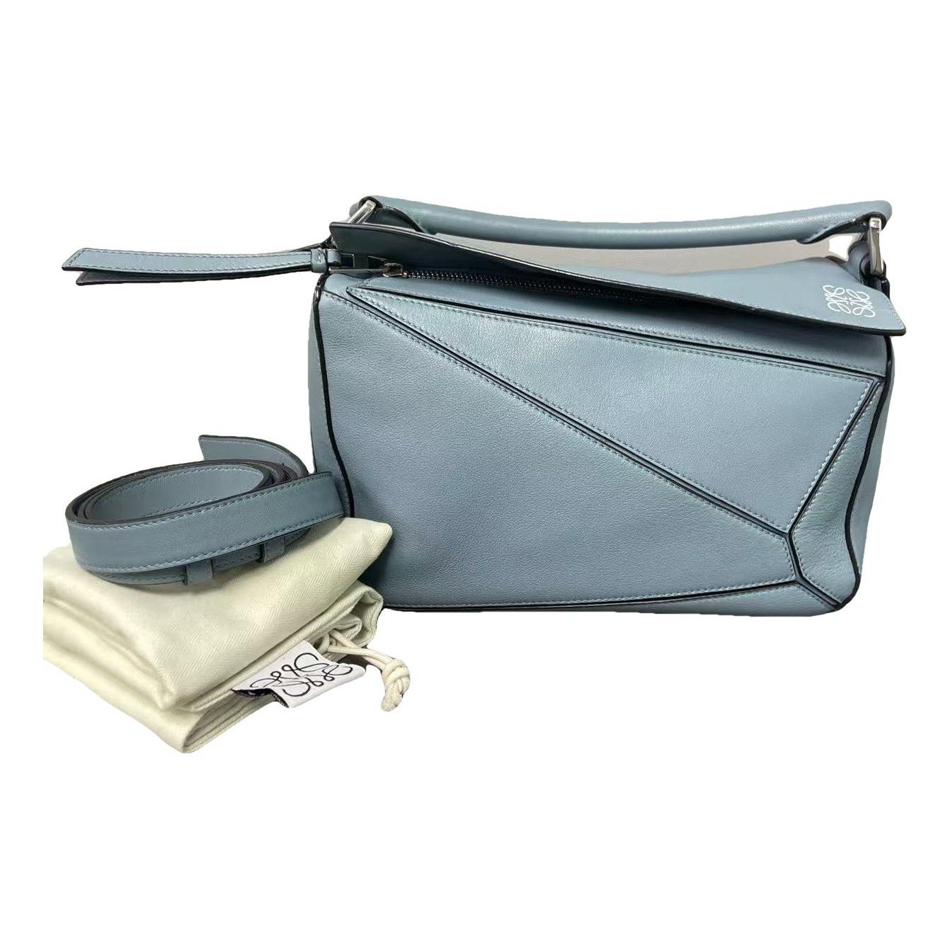 Puzzle leather handbag