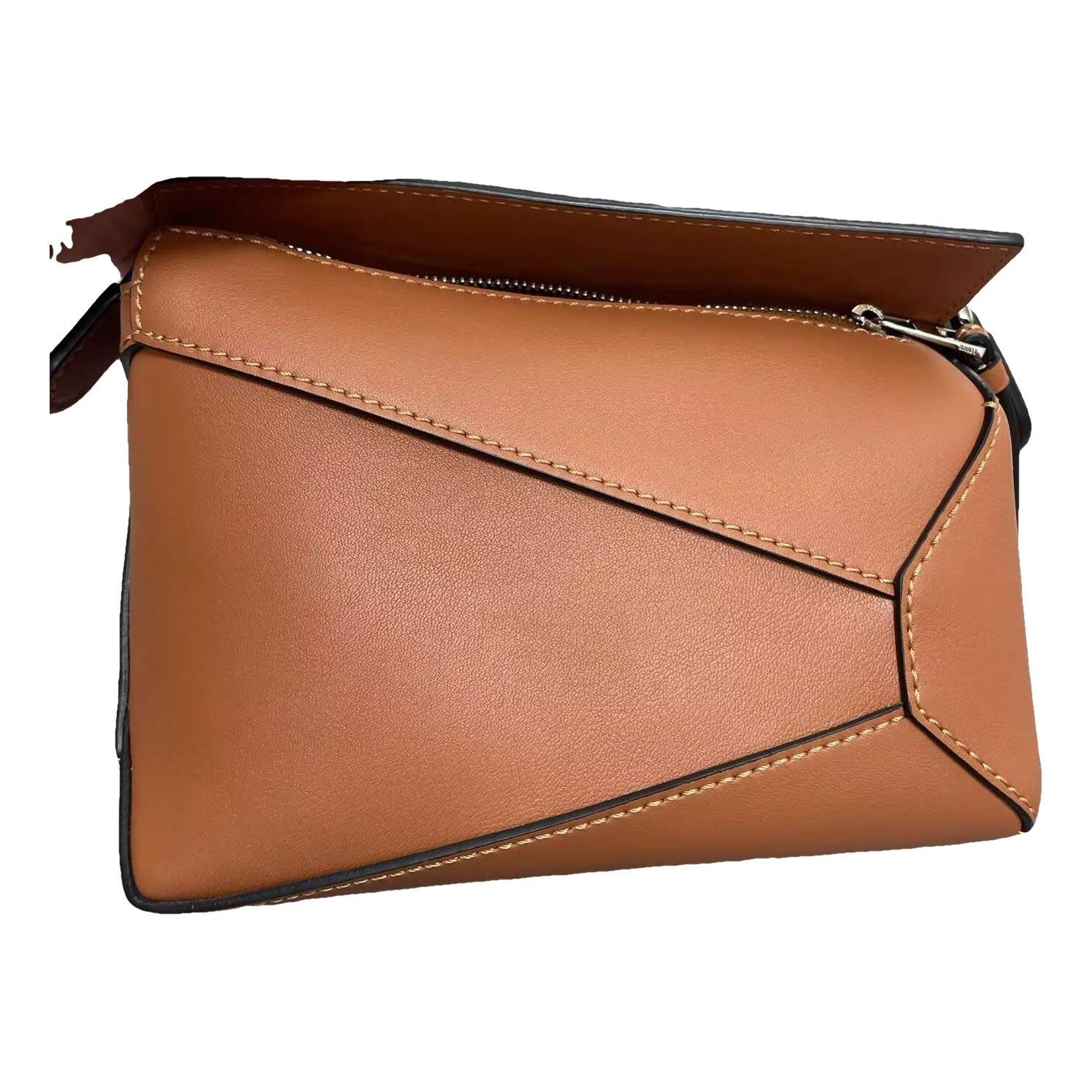 Puzzle leather handbag