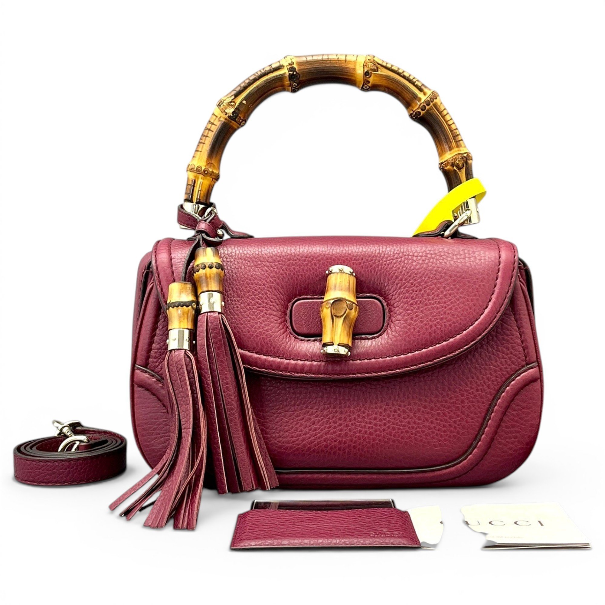 Convertible Pompon Bamboo Top Handle leather handbag