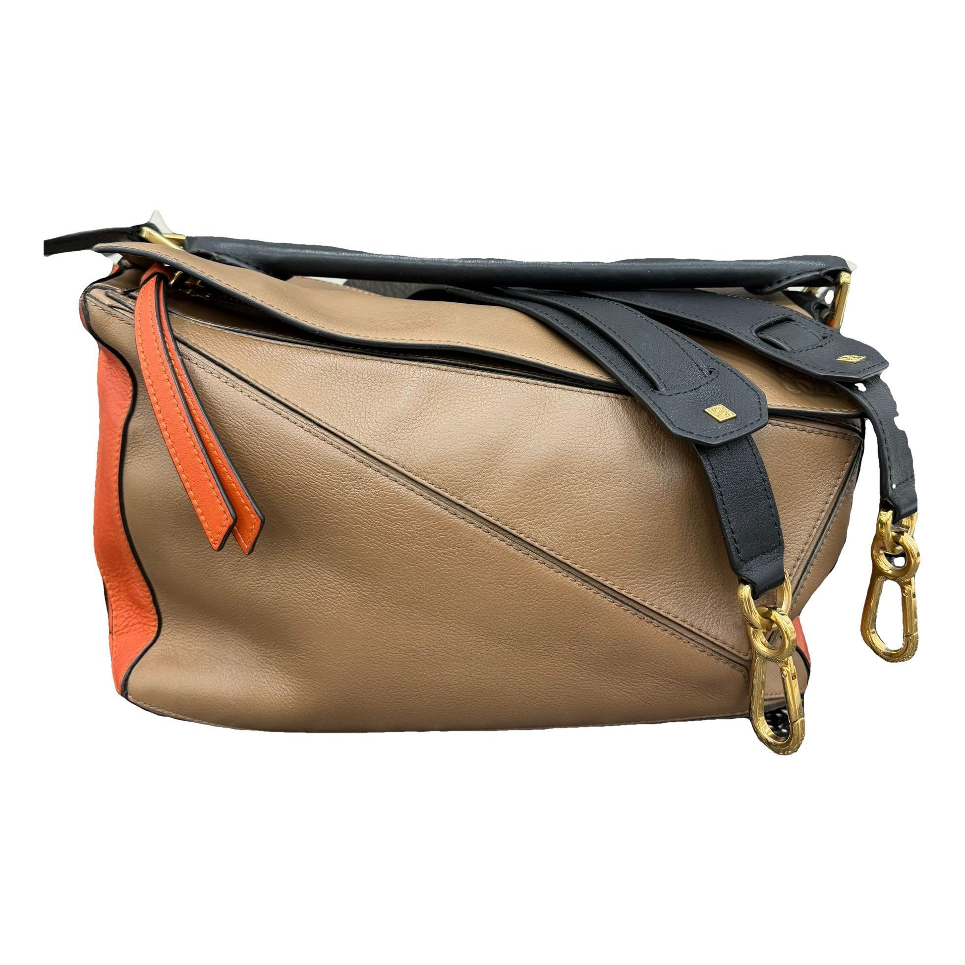 Puzzle leather handbag