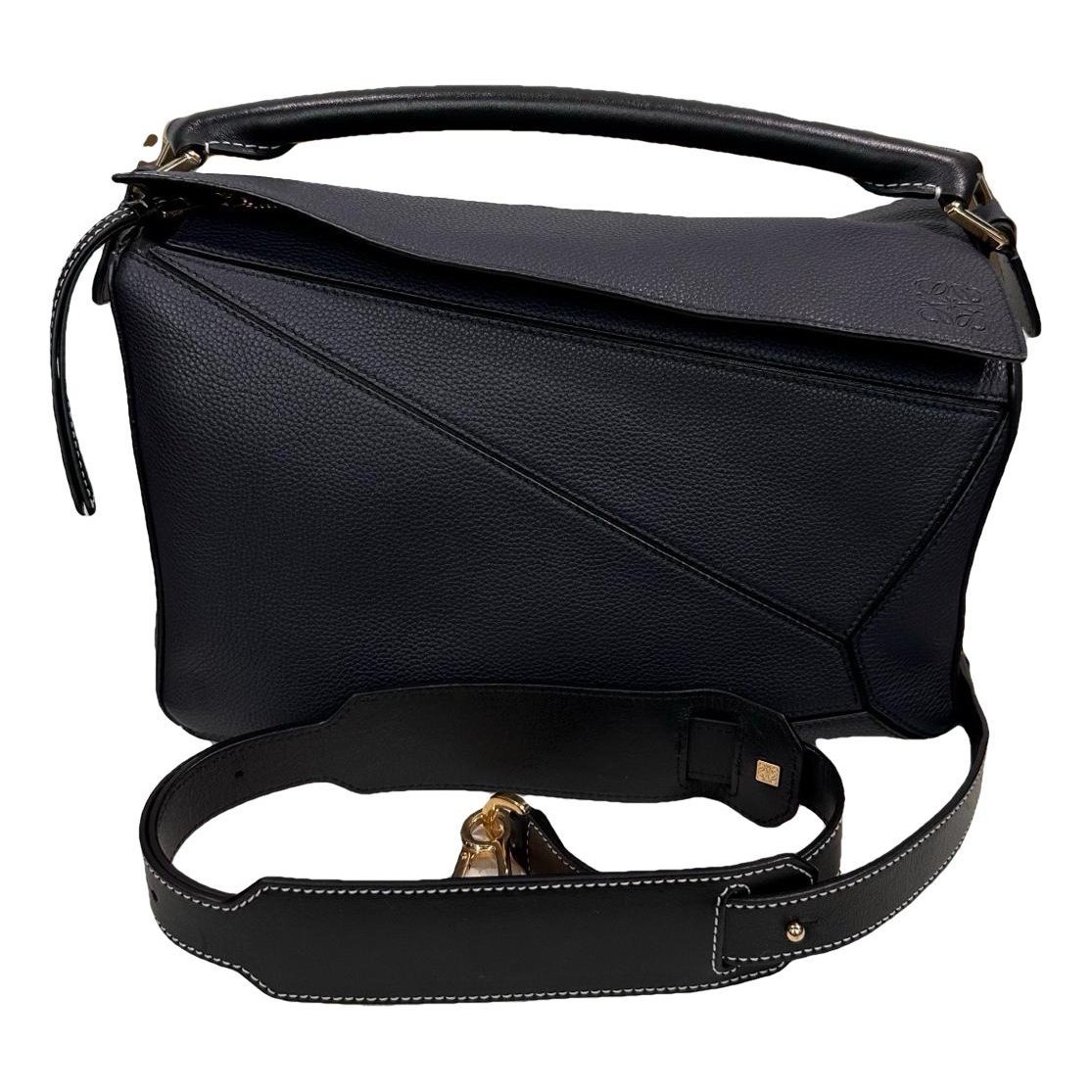 Puzzle leather handbag