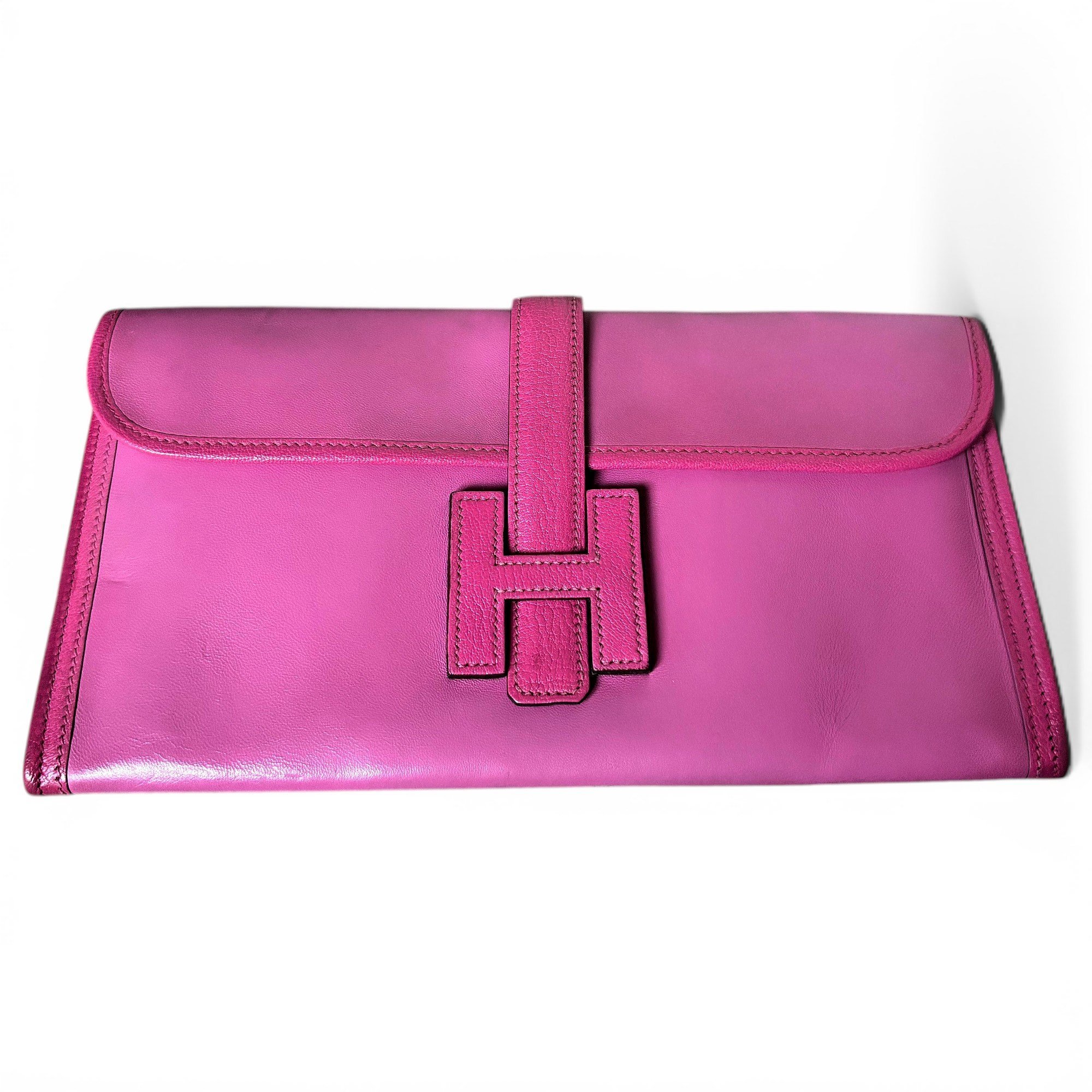 Jige leather clutch bag