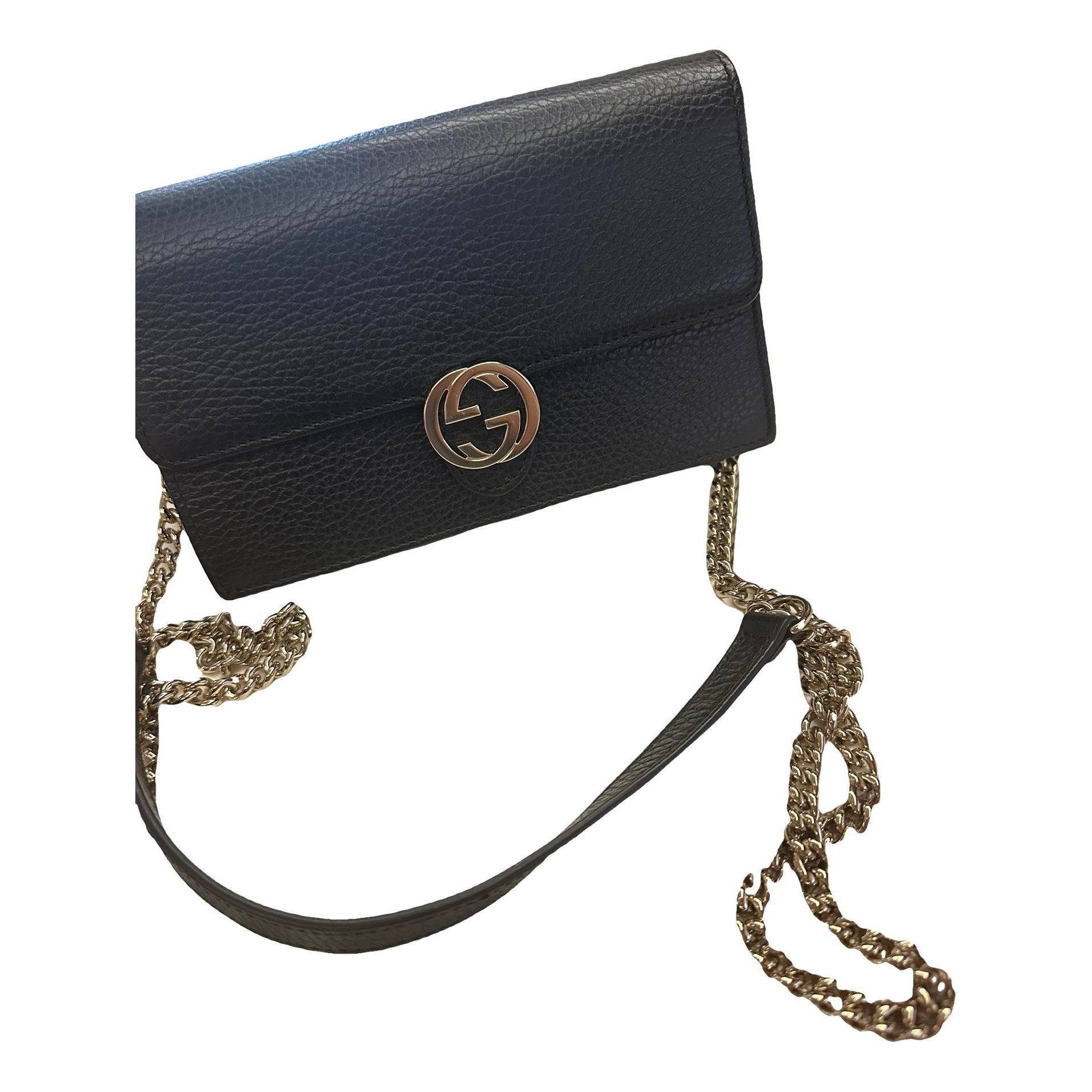 Interlocking leather clutch bag