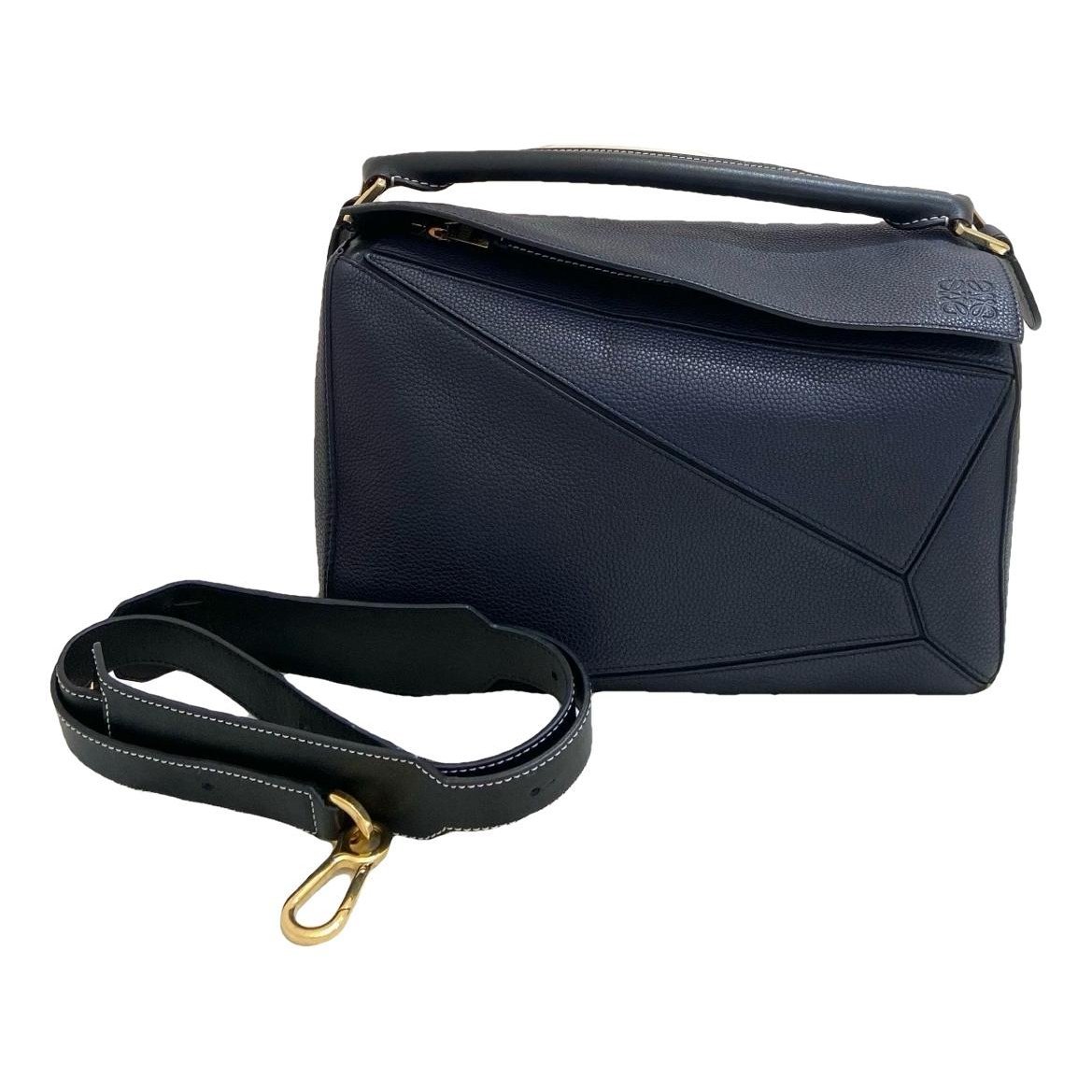Puzzle leather handbag