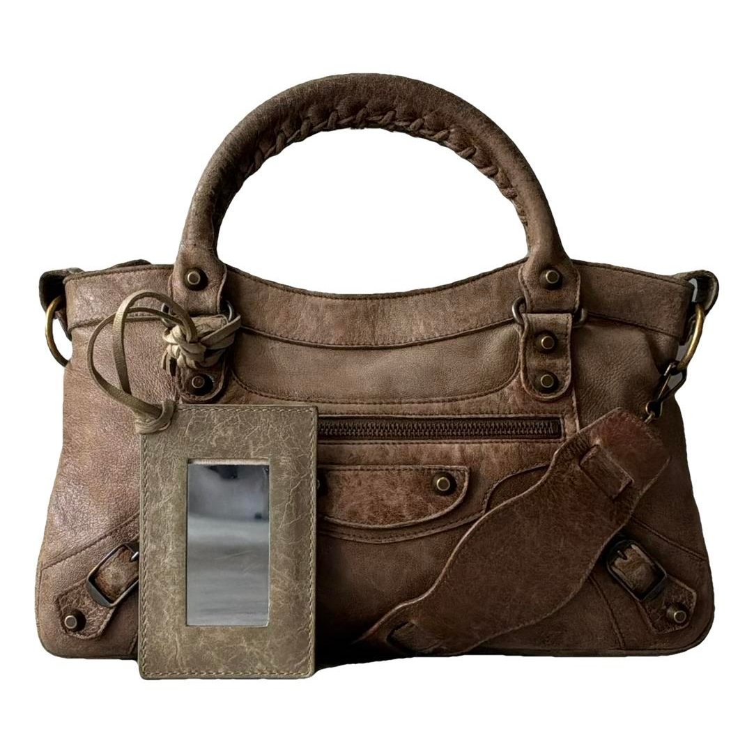 First leather handbag