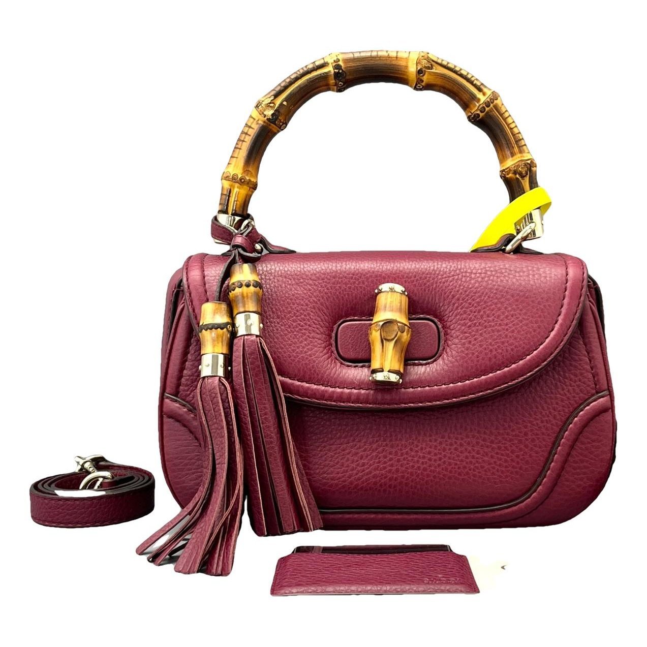 Convertible Pompon Bamboo Top Handle leather handbag