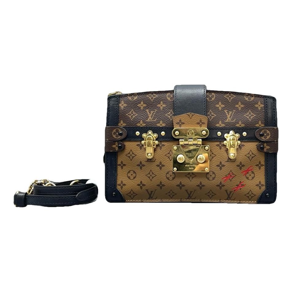 Pochette Trunk leather handbag