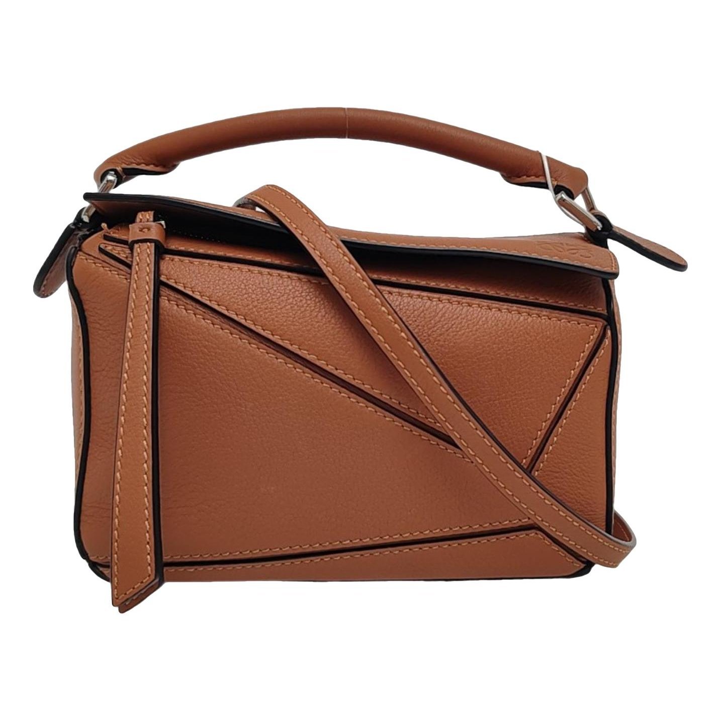 Puzzle leather handbag