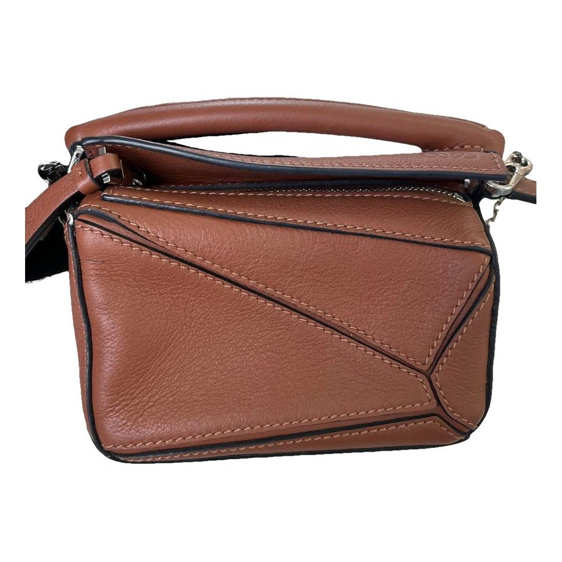 Puzzle leather handbag