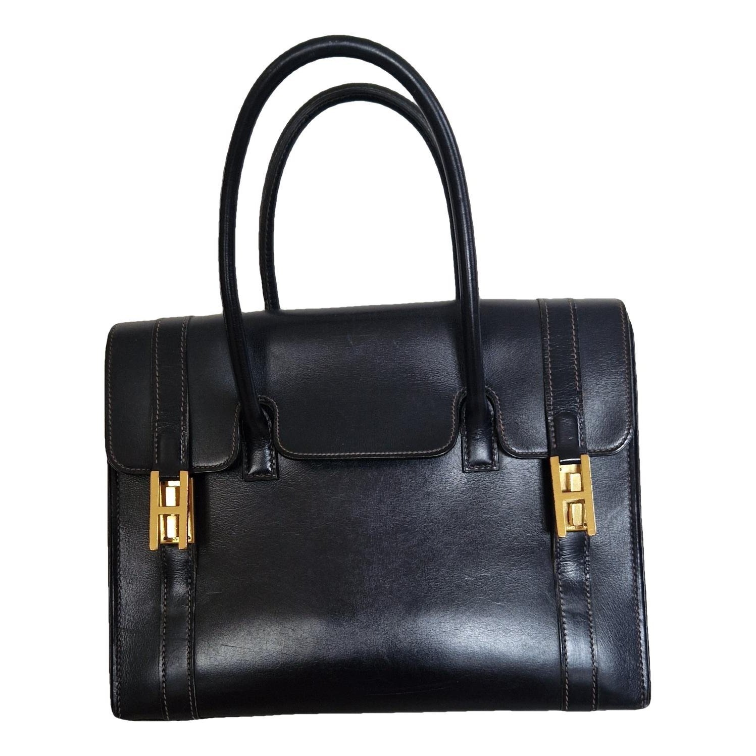 Drag leather handbag