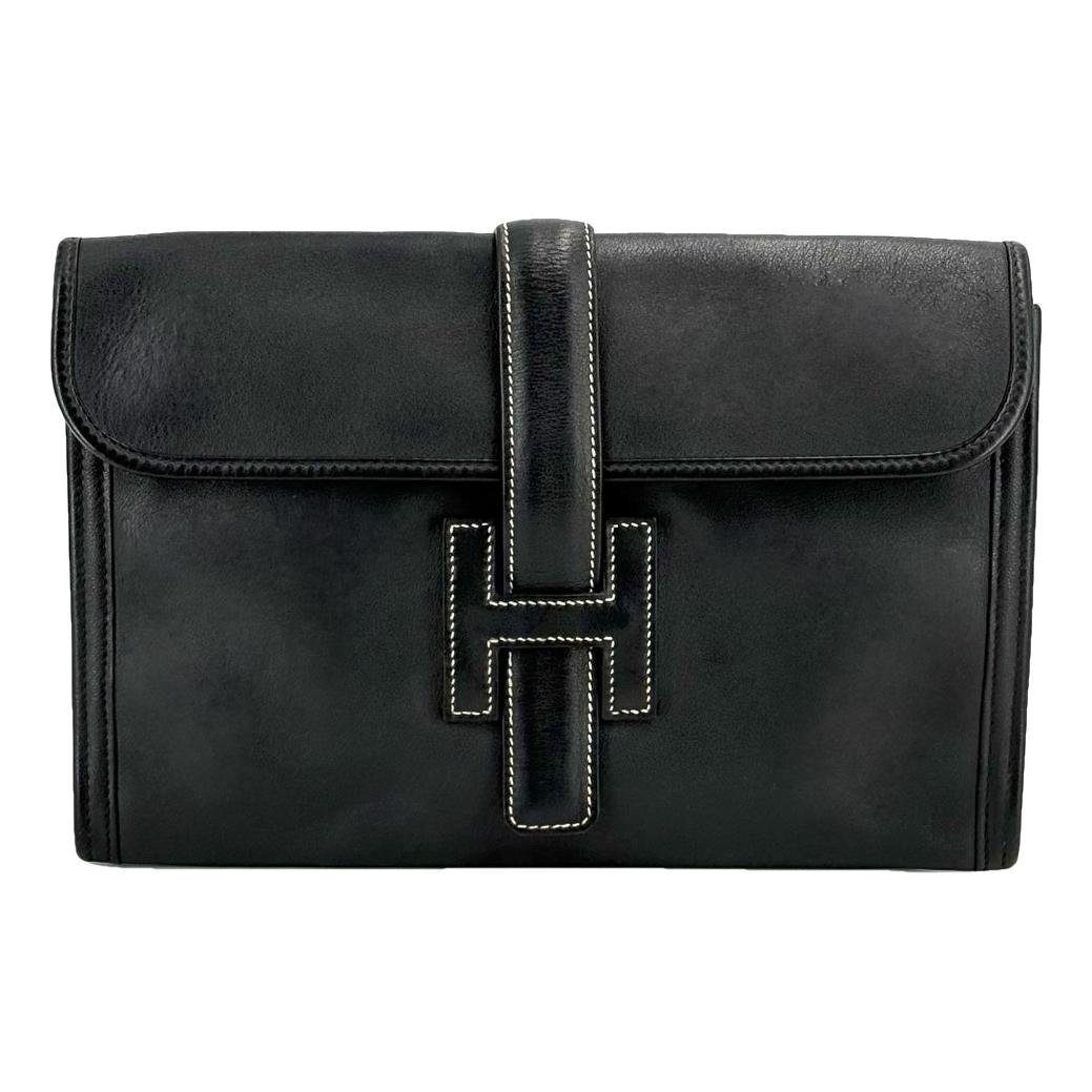 Jige leather clutch bag