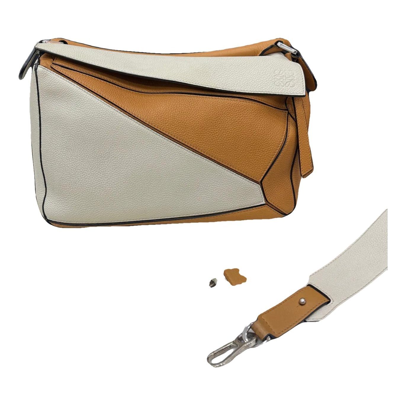 Puzzle leather crossbody bag