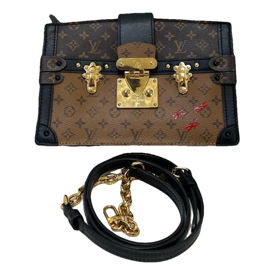 Pochette Trunk leather handbag