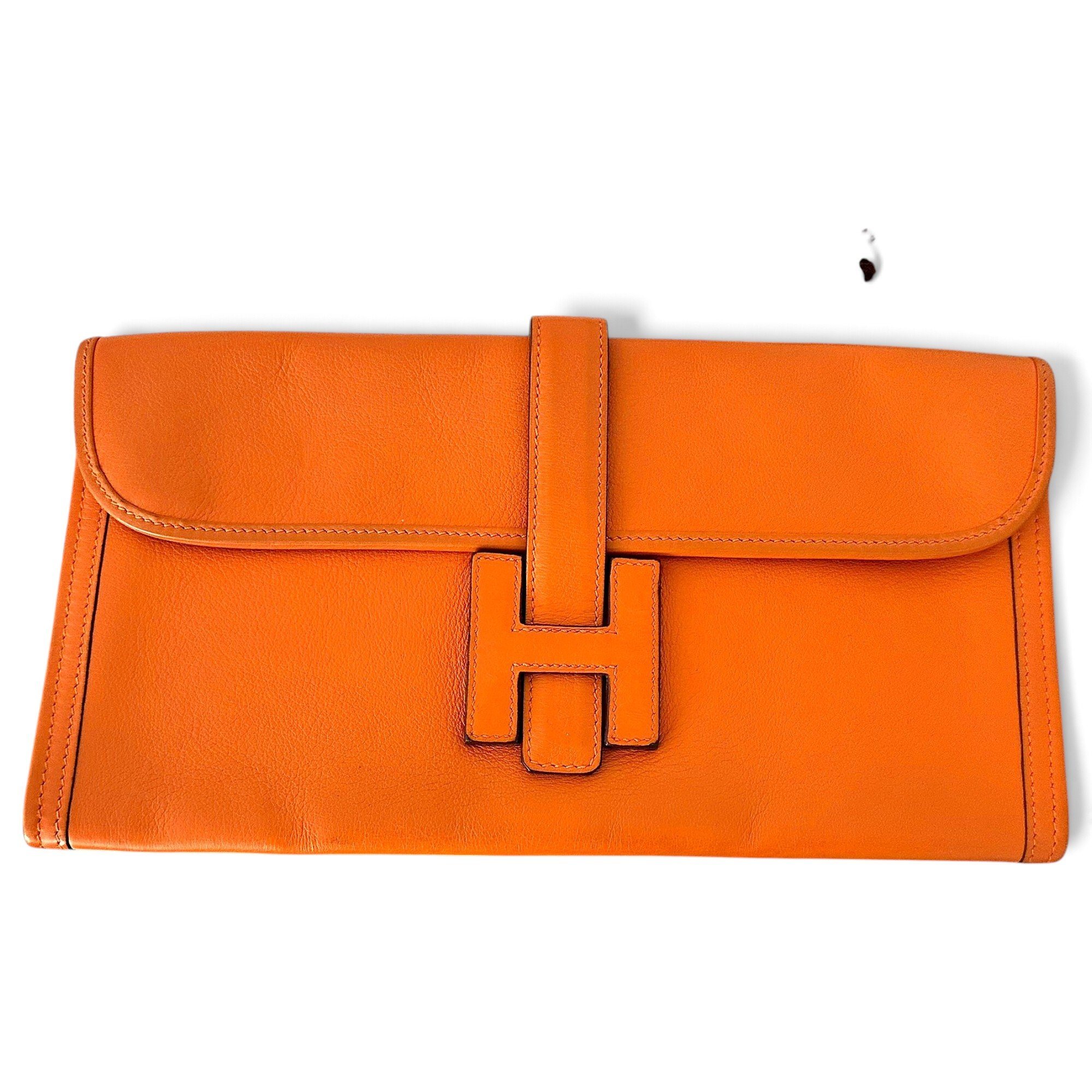 Jige leather clutch bag