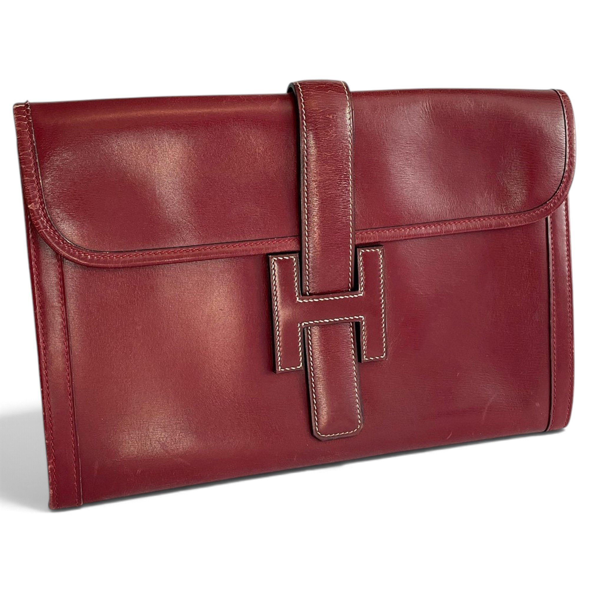Jige leather clutch bag