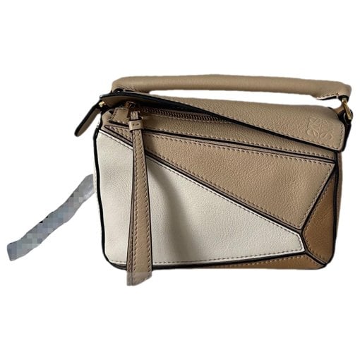 Puzzle leather handbag