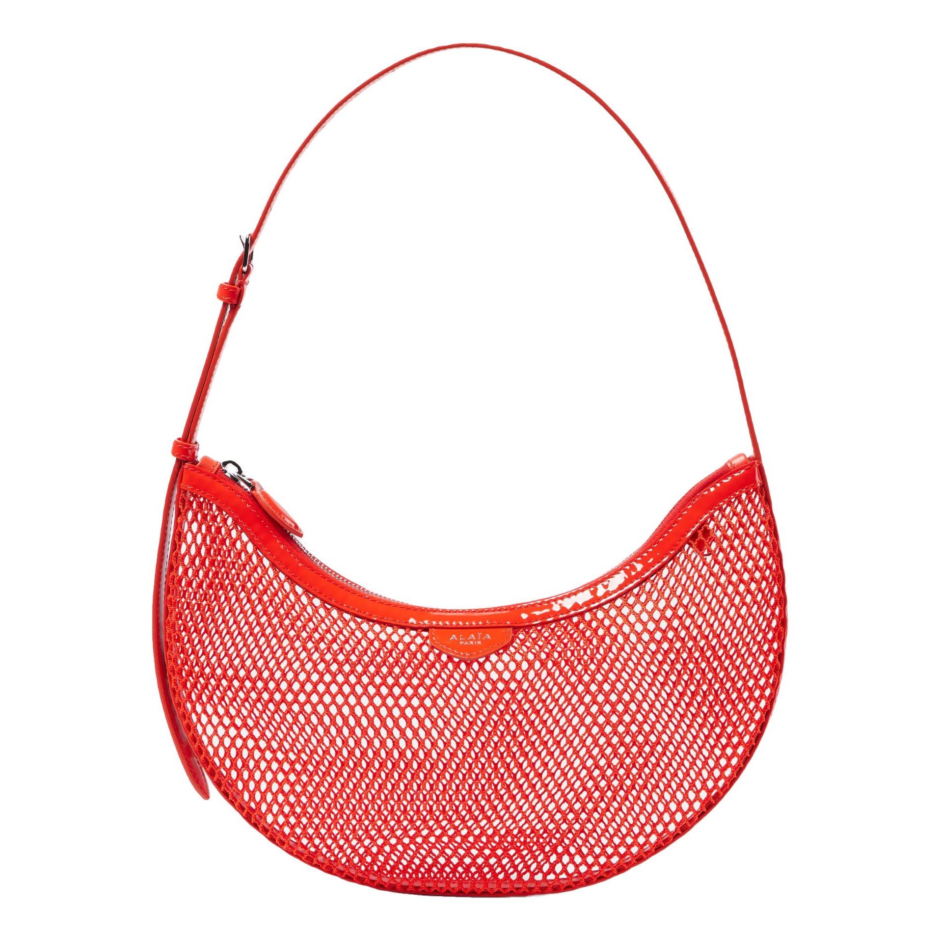 Alaia One Piece Demi Lune patent leather handbag