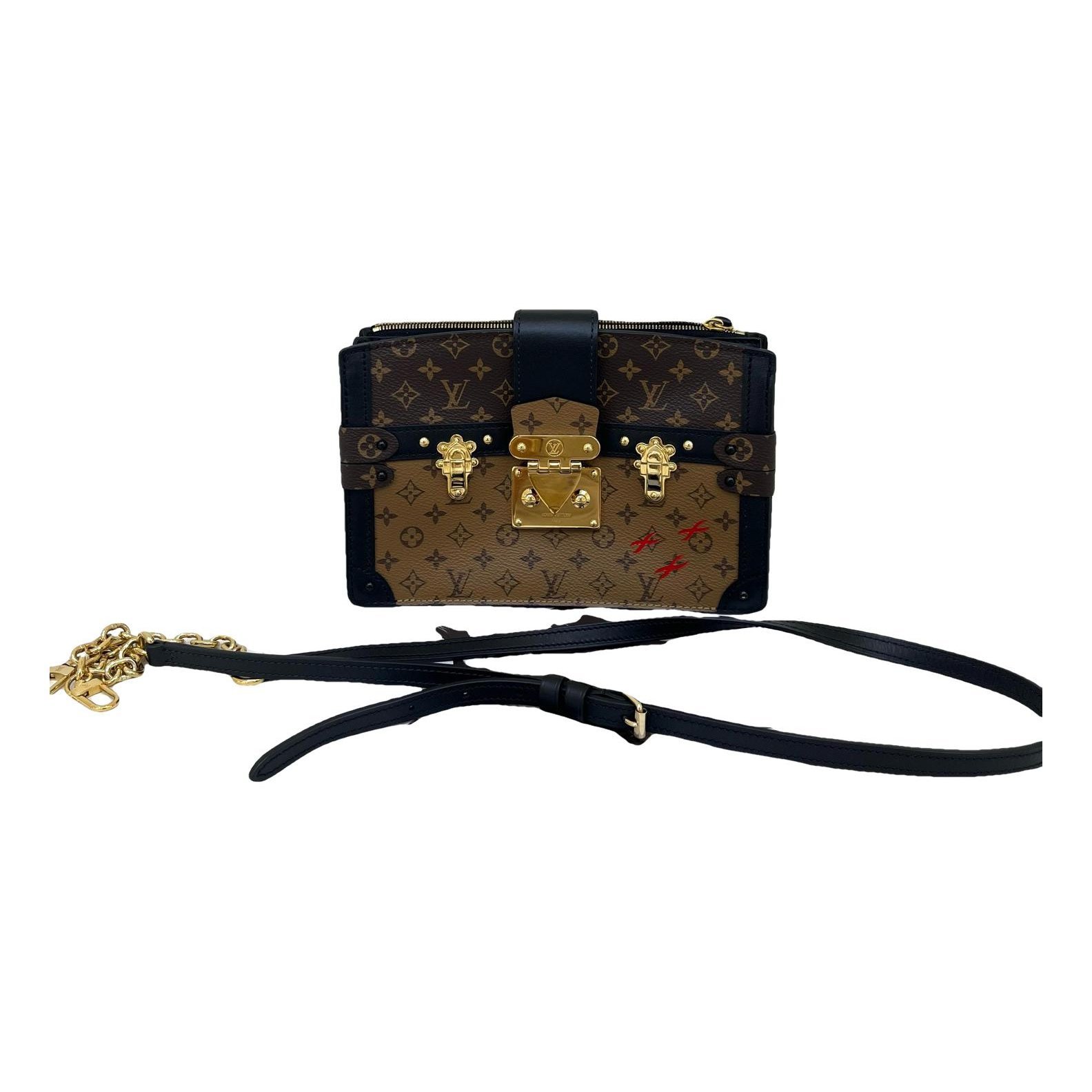 Pochette Trunk leather handbag