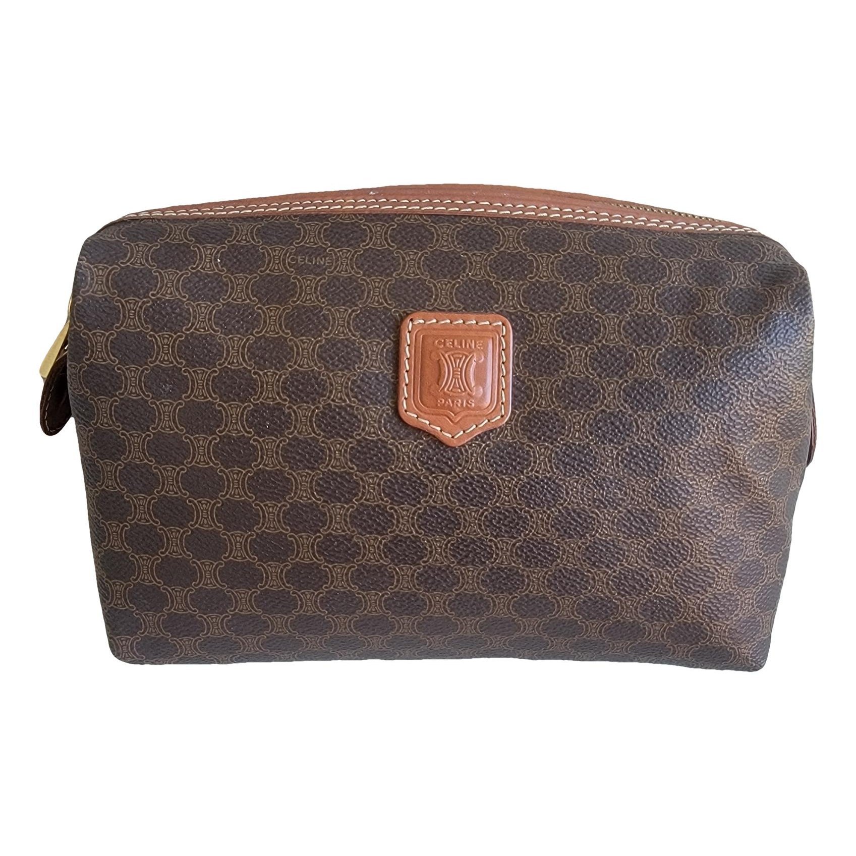 Triomphe Vintage leather clutch bag