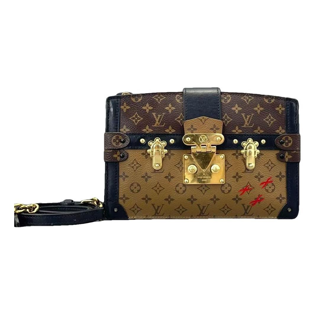 Pochette Trunk leather handbag