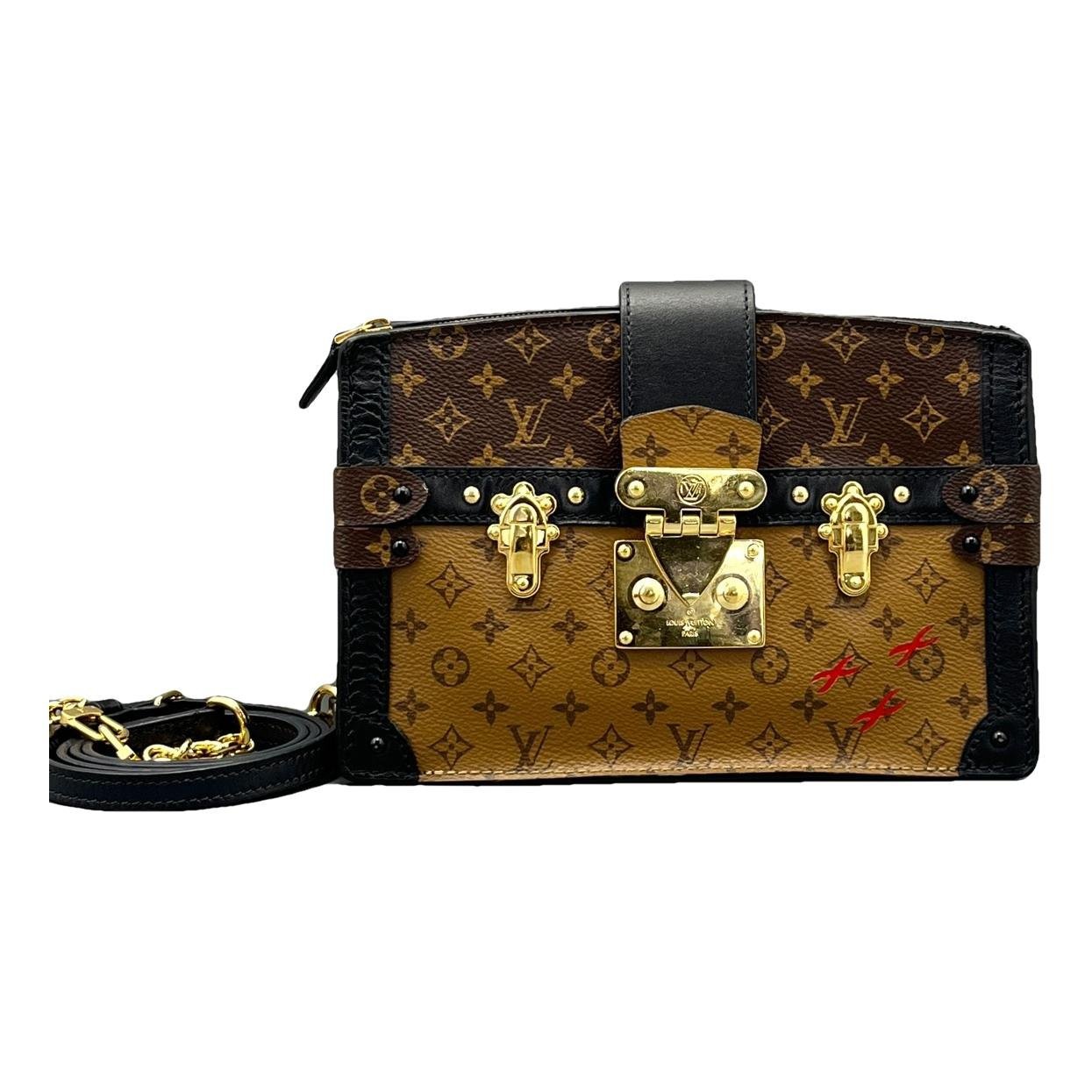 Pochette Trunk leather handbag