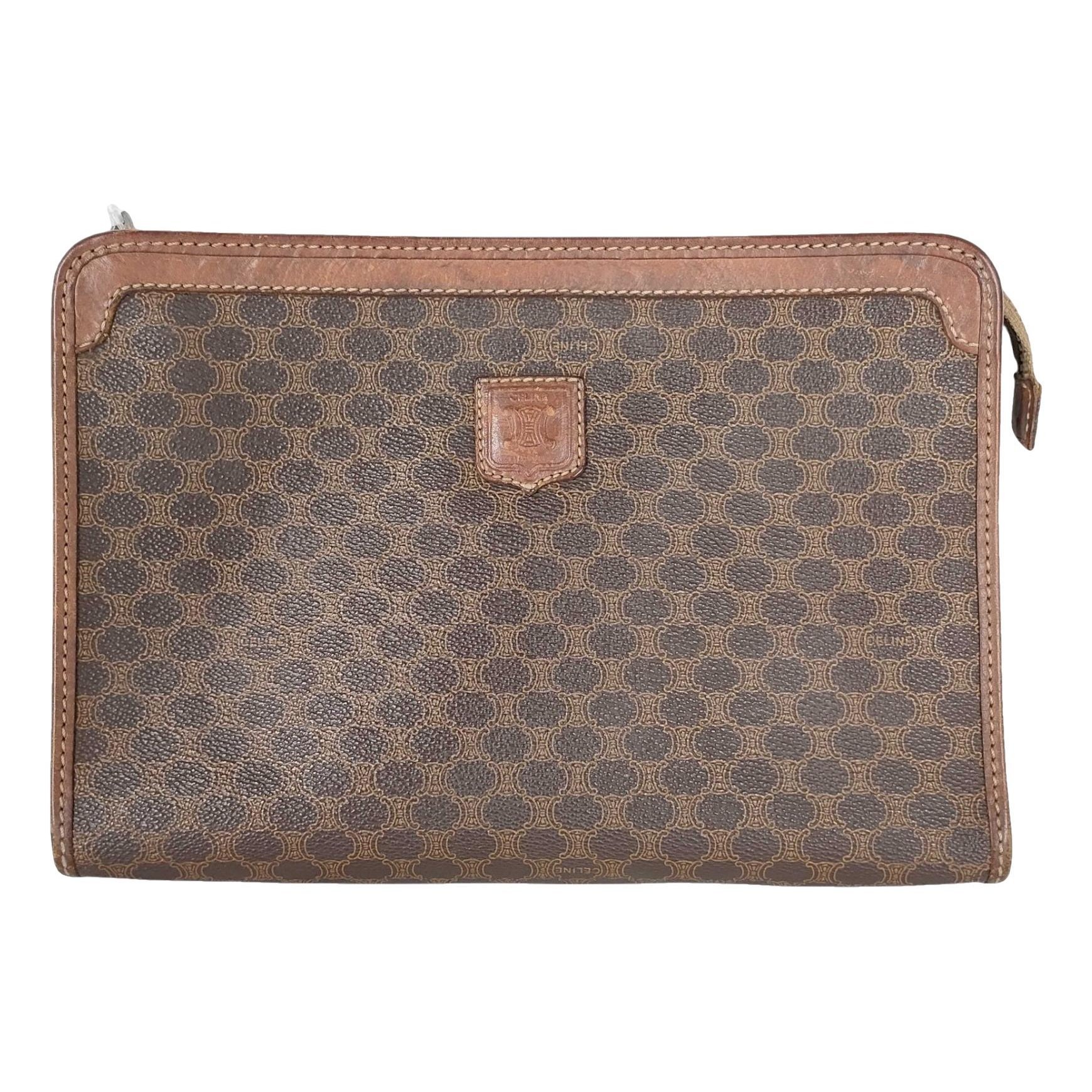 Triomphe Vintage leather clutch bag