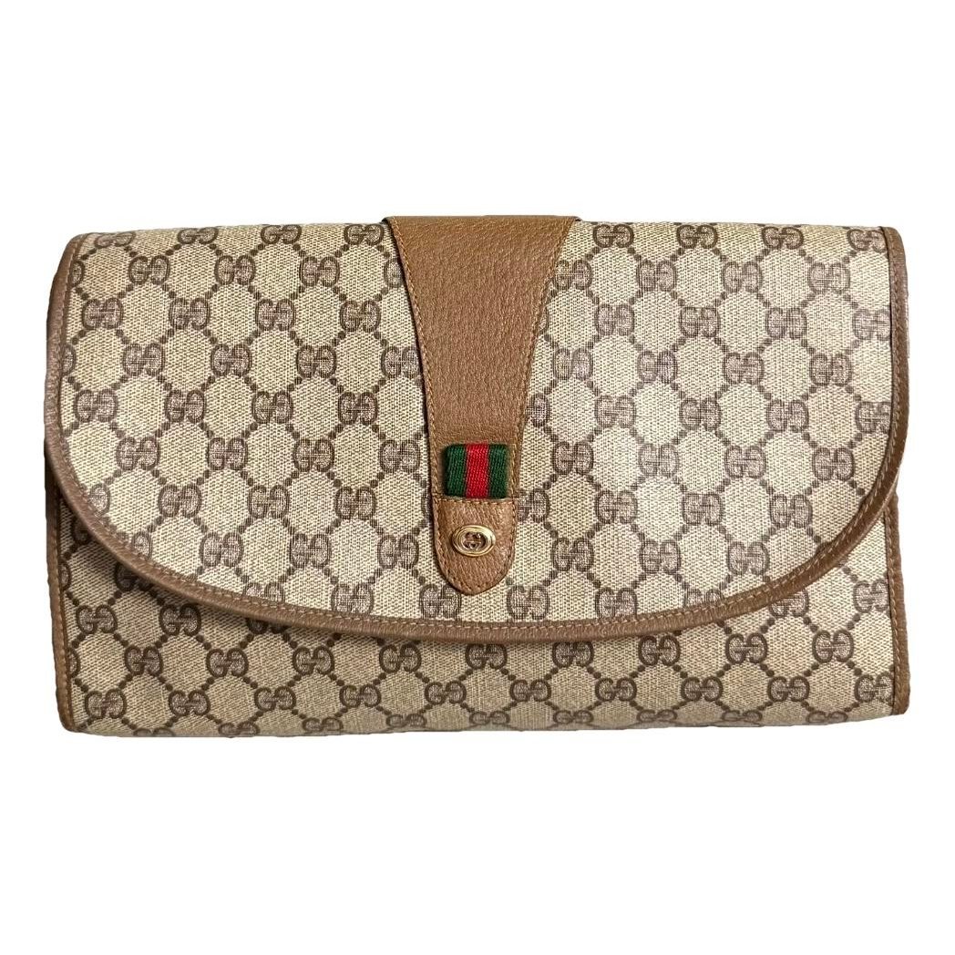 Ophidia patent leather clutch bag