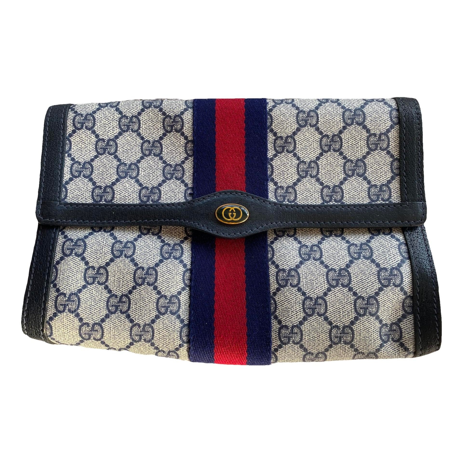 Ophidia cloth clutch bag