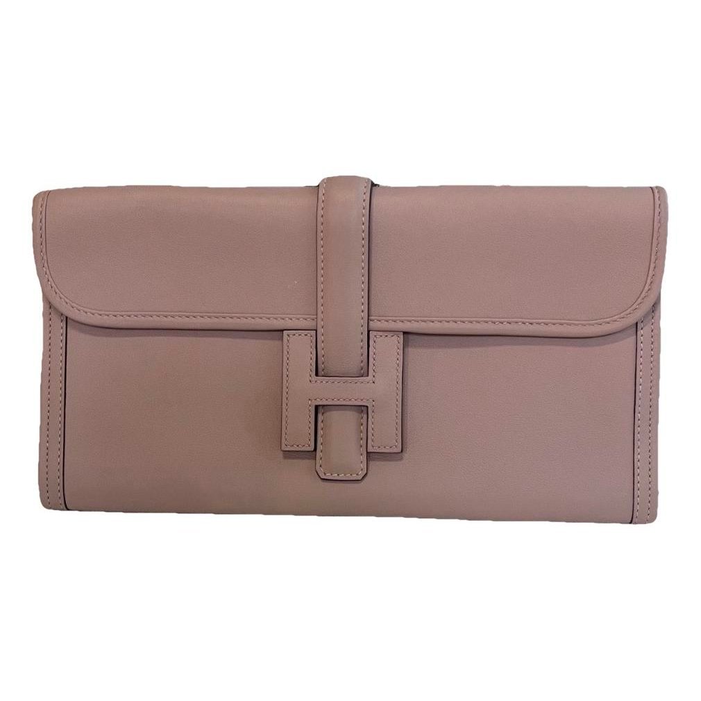 Jige leather clutch bag