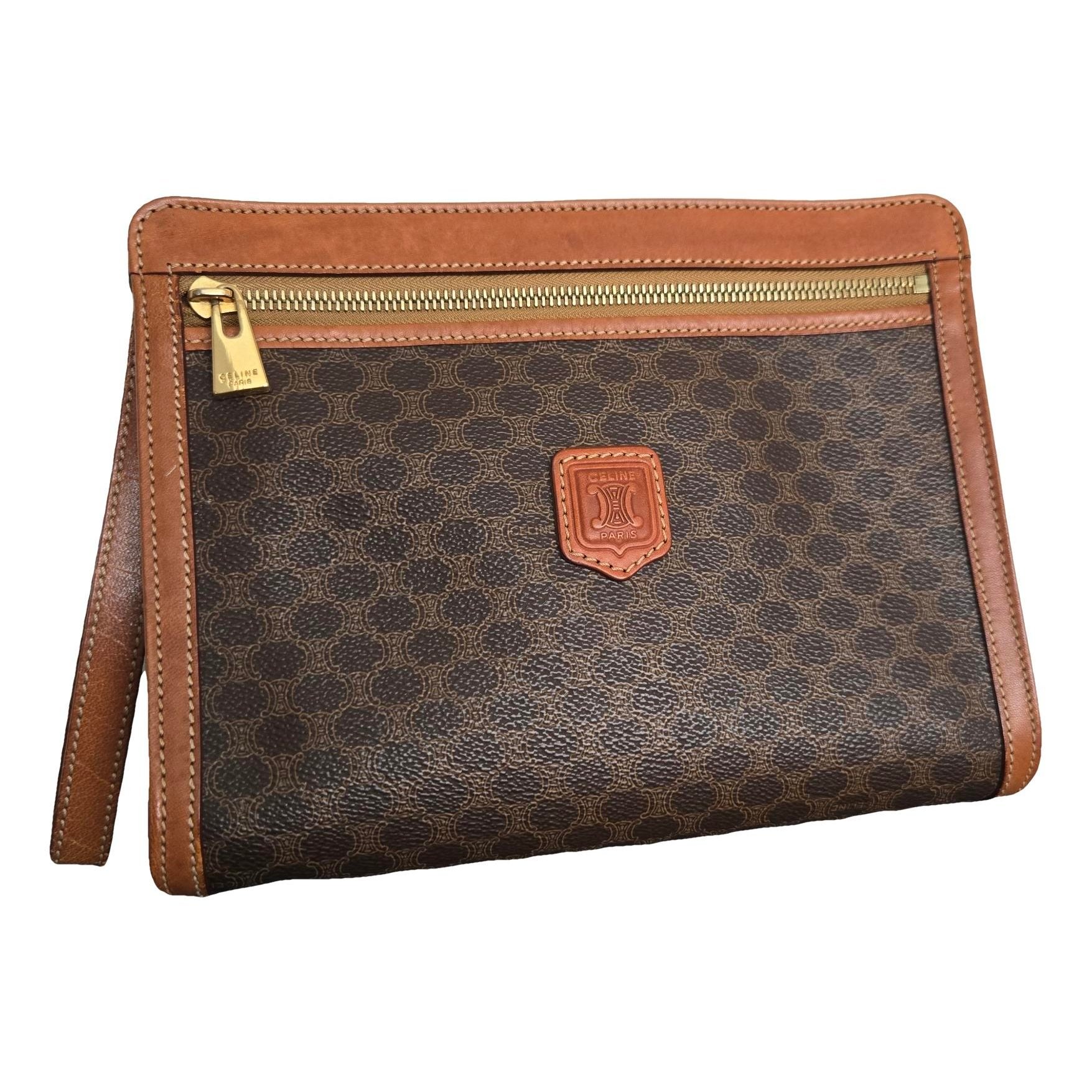 Triomphe Vintage leather clutch bag