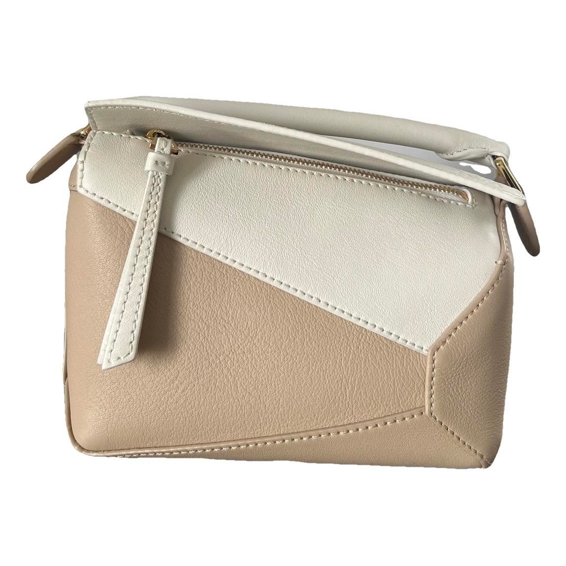 Puzzle leather handbag