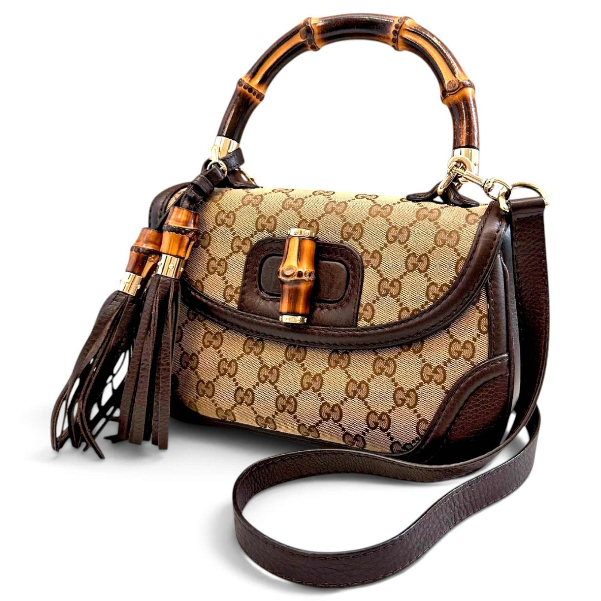 Convertible Pompon Bamboo Top Handle leather handbag