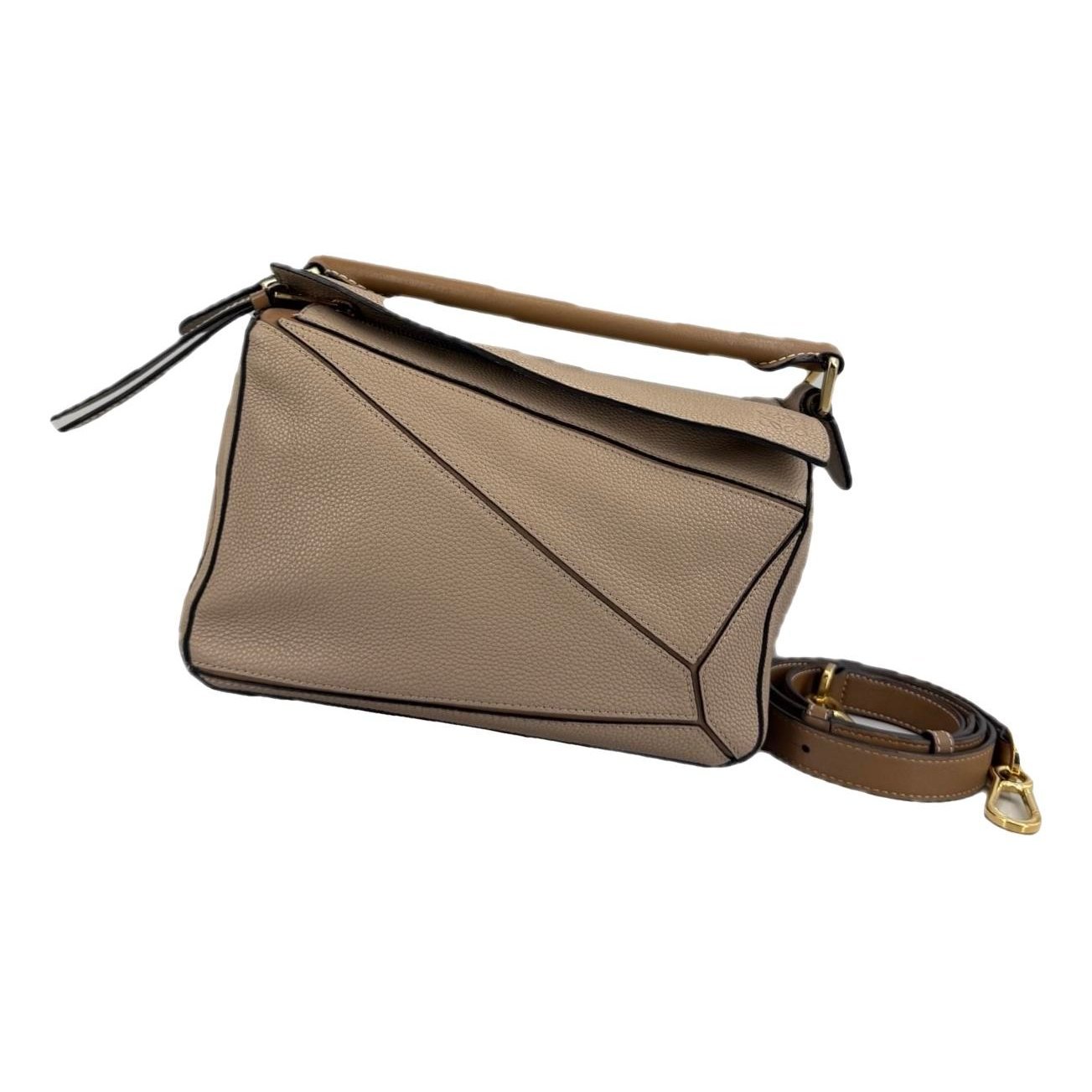 Puzzle leather handbag