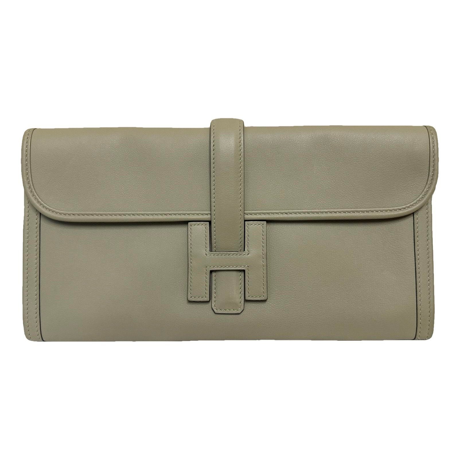 Jige leather clutch bag