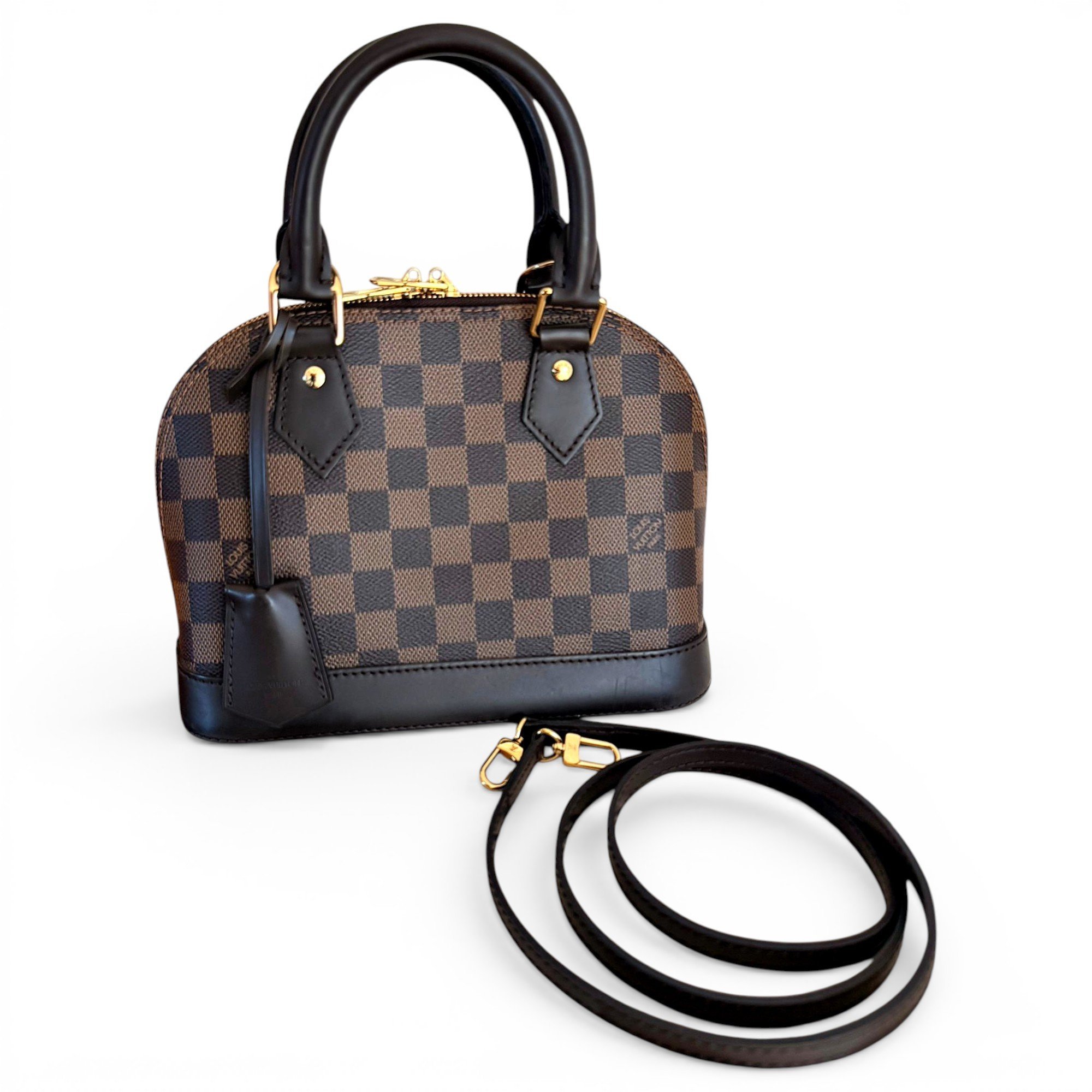 Louis Vuitton Alma BB cloth handbag