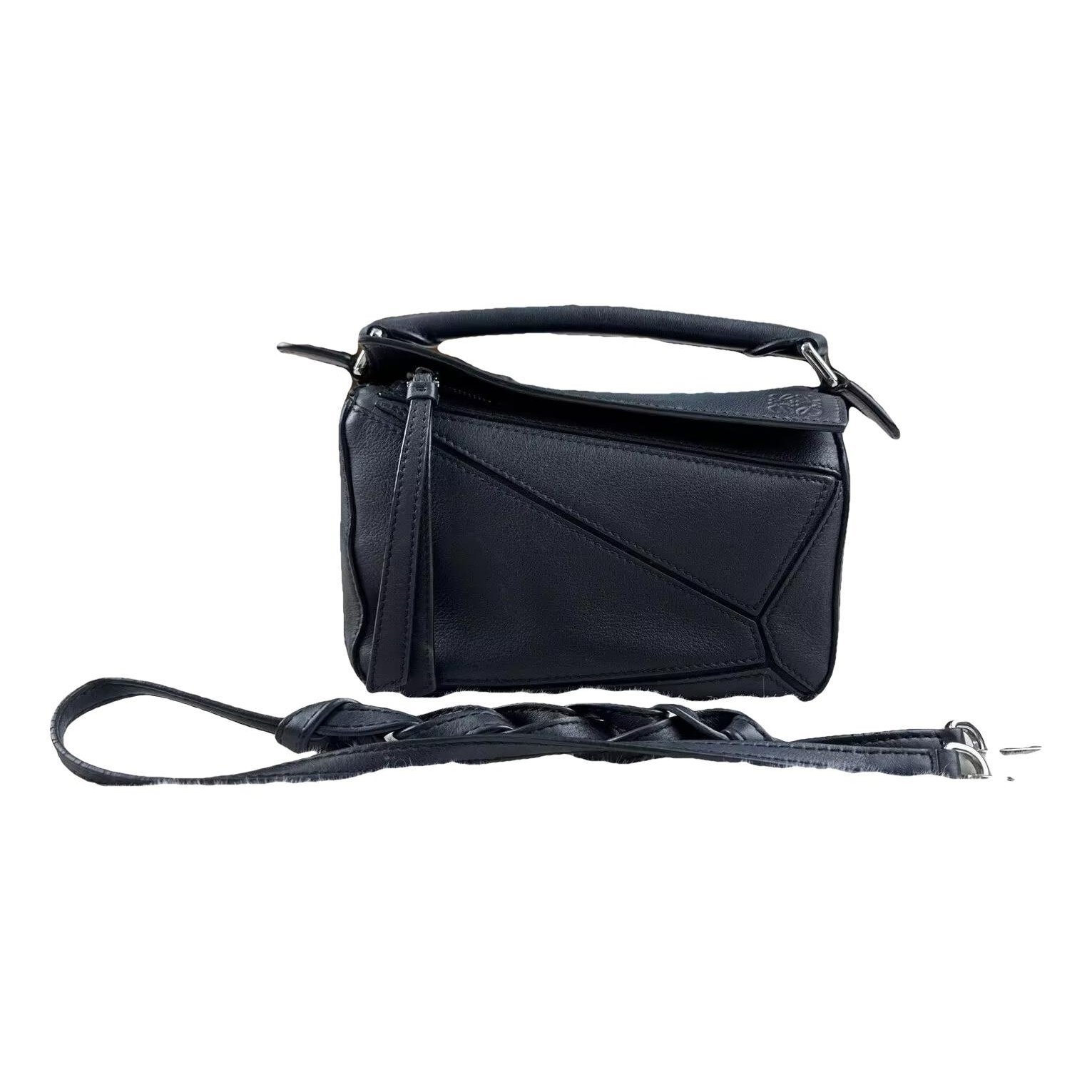 Puzzle leather handbag