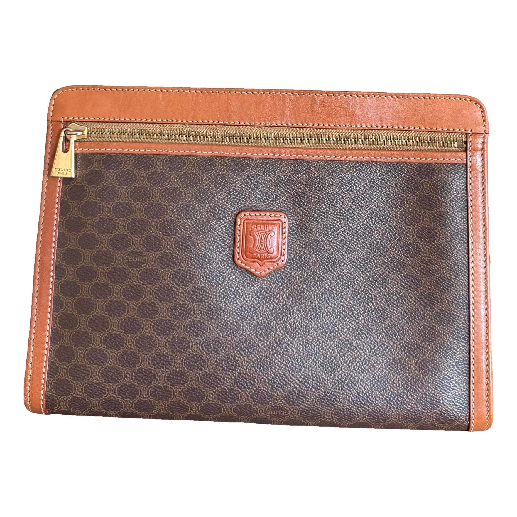 Triomphe Vintage leather clutch bag