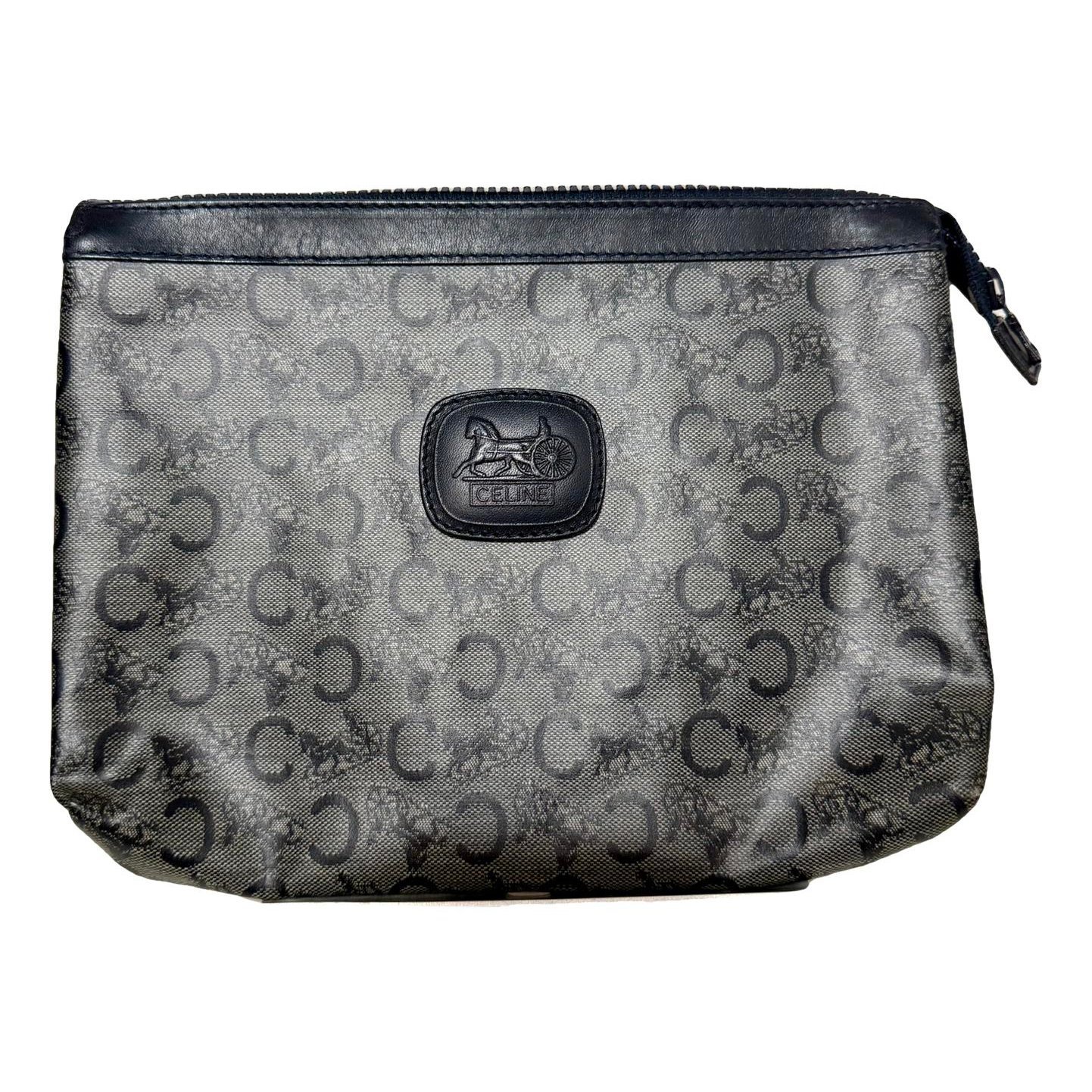 Triomphe Vintage leather clutch bag