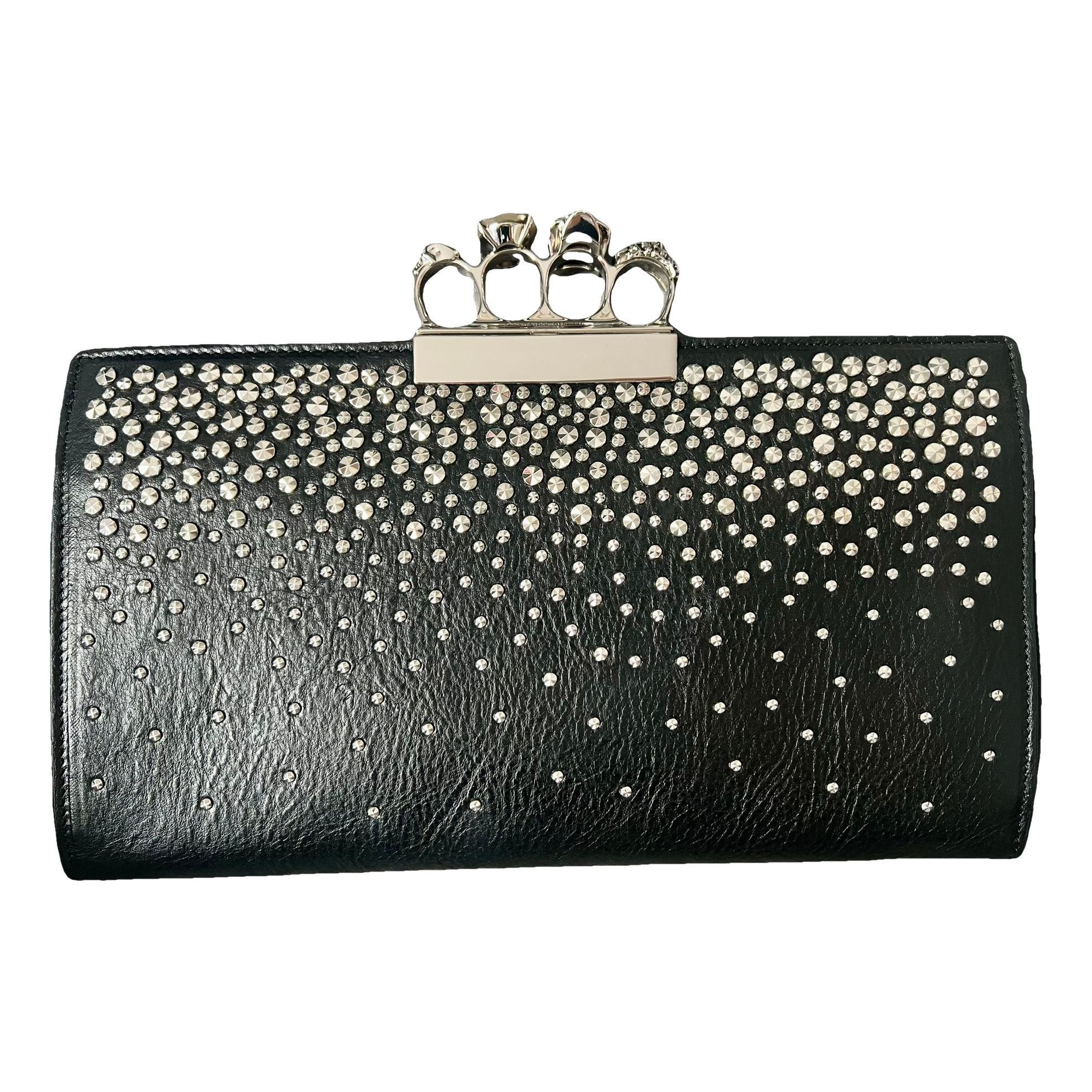 Knuckle leather clutch bag