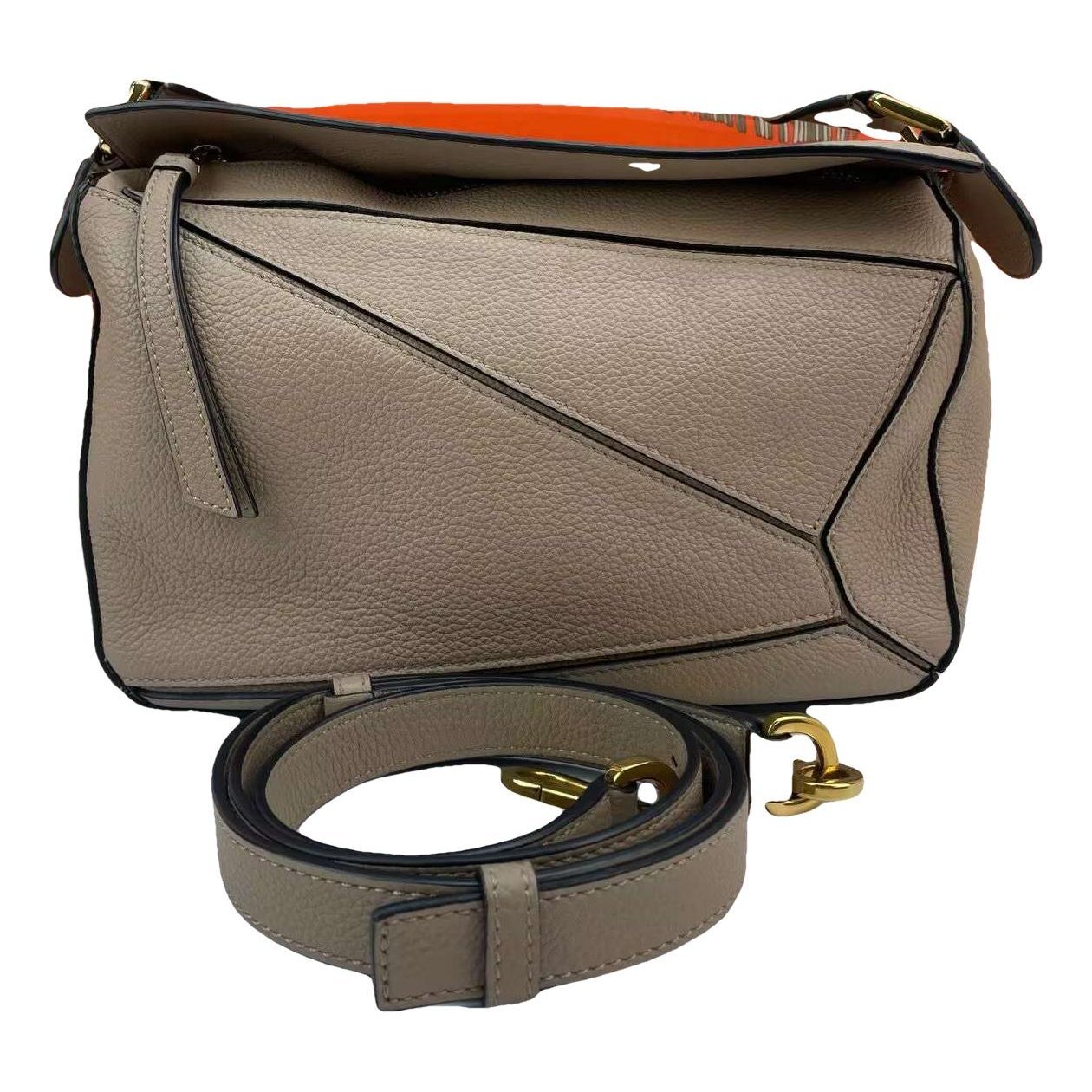 Puzzle leather handbag