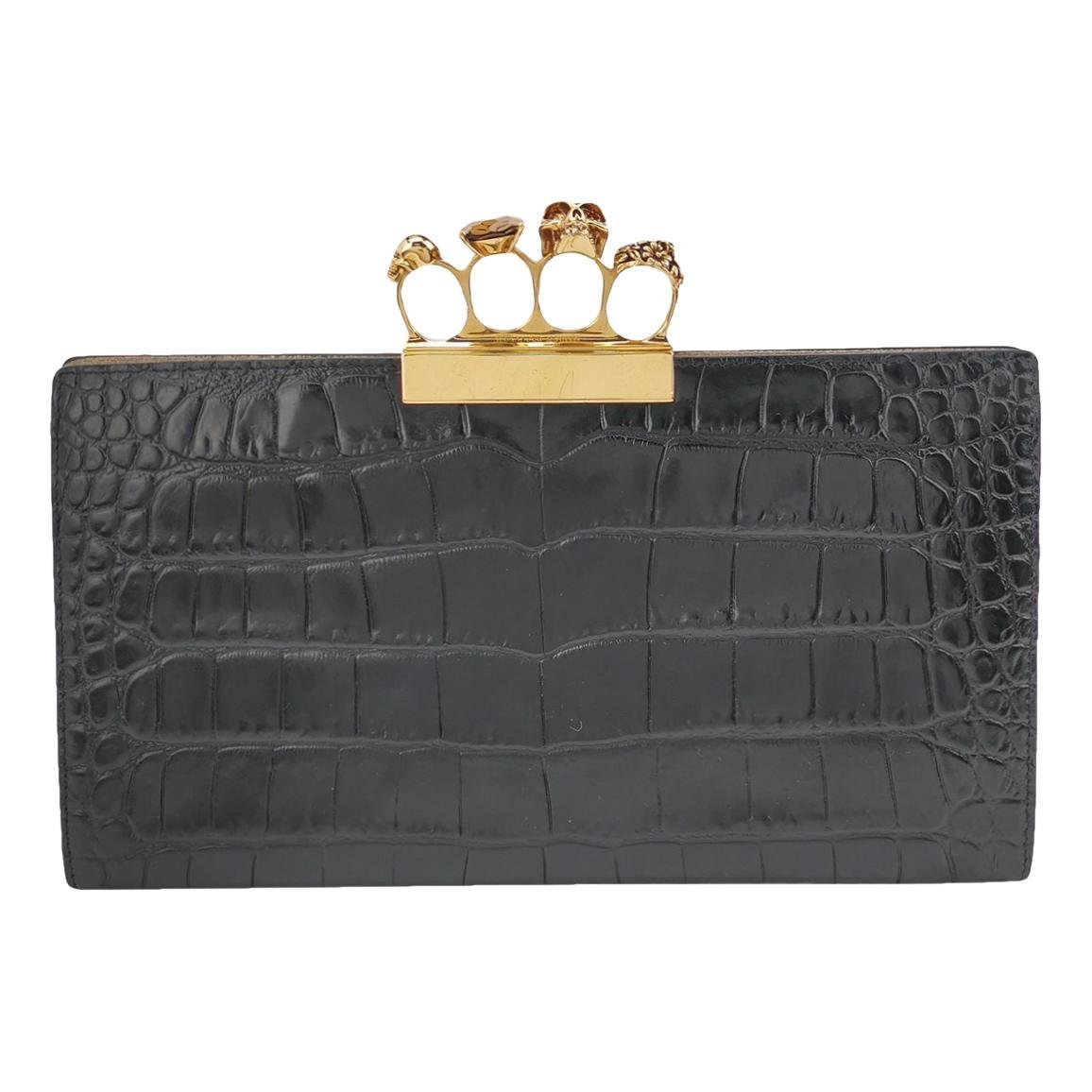 Knuckle leather clutch bag