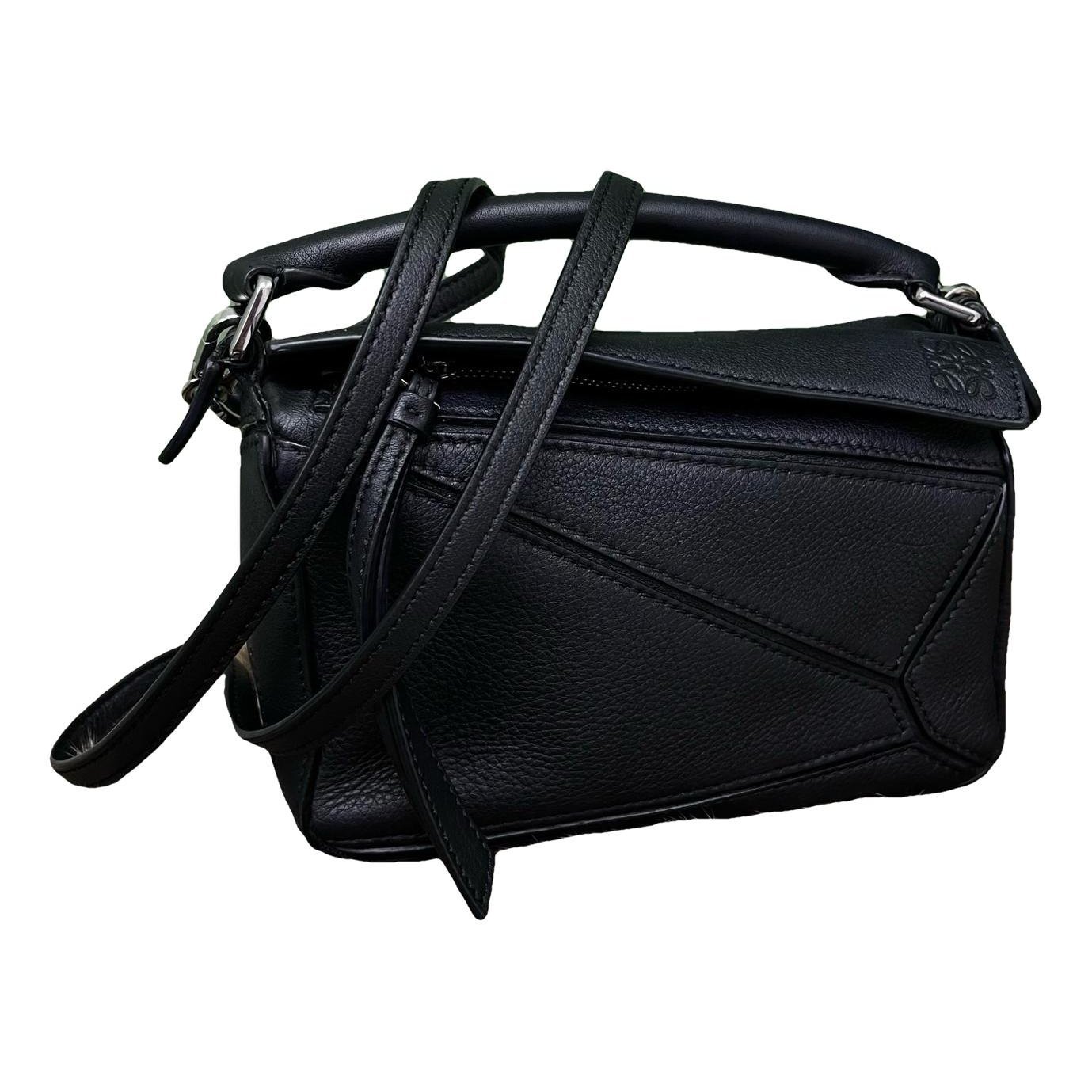 Puzzle leather handbag