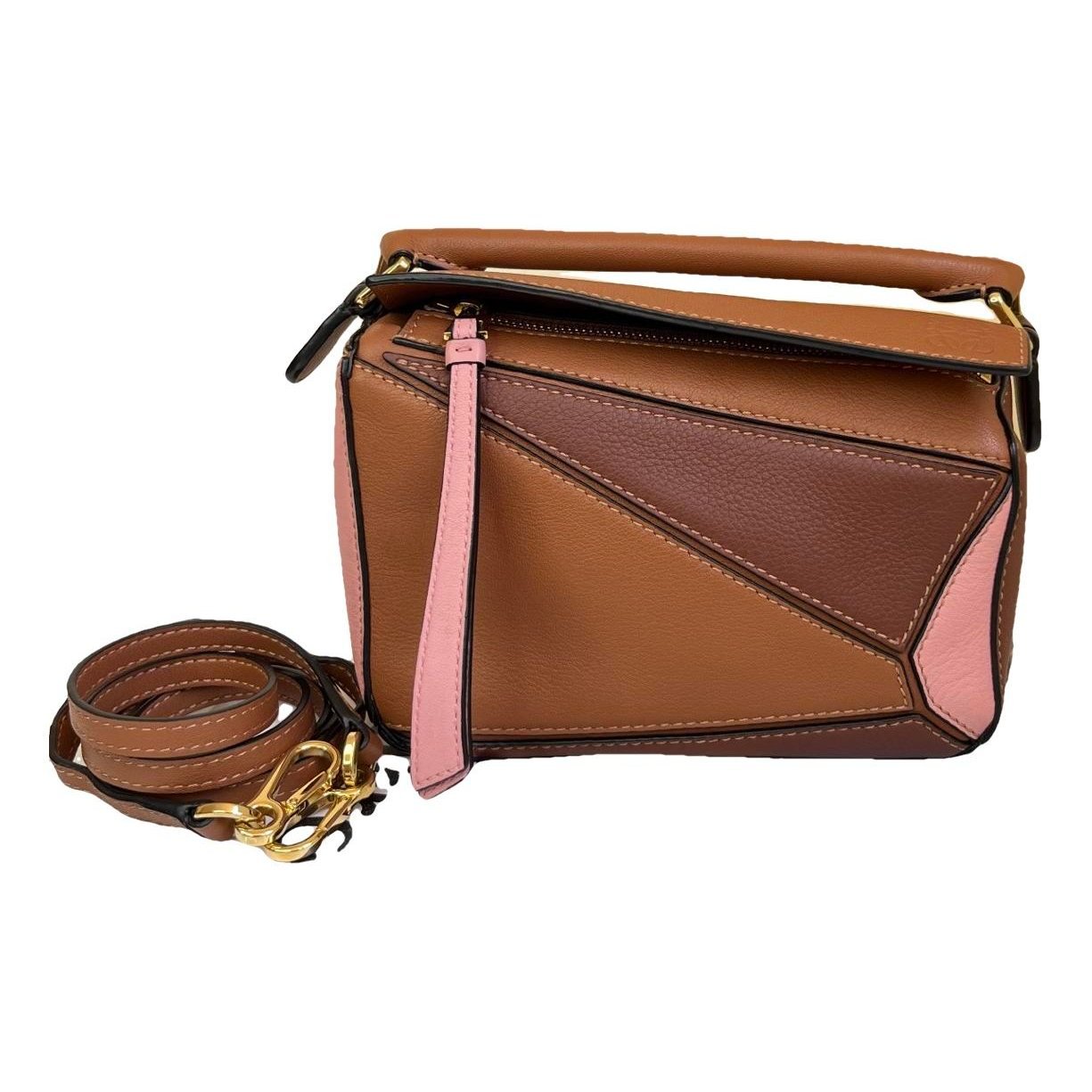 Puzzle leather handbag