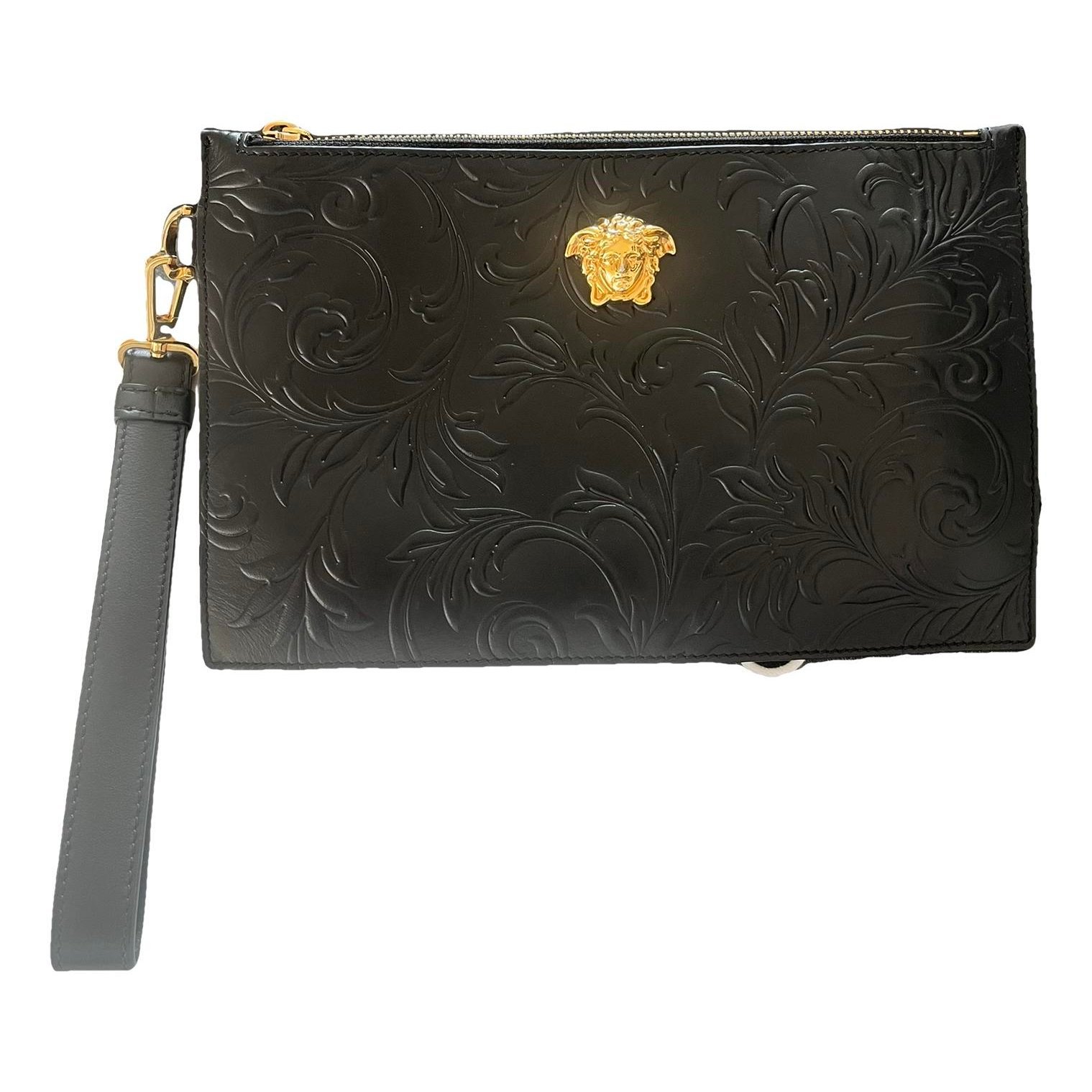 La Medusa leather clutch bag