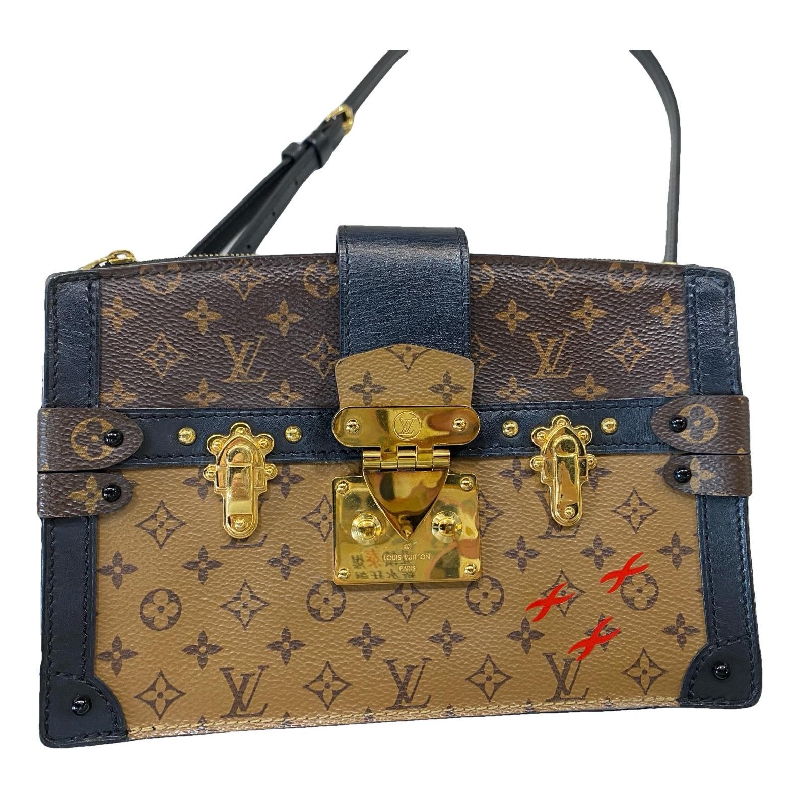 Pochette Trunk leather handbag