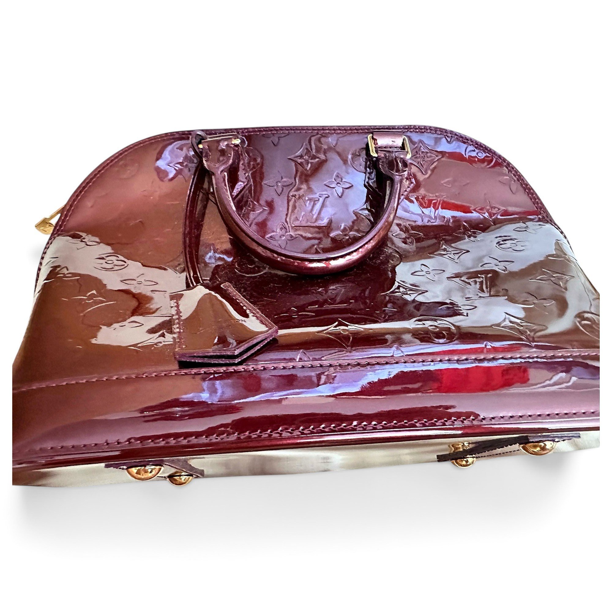 Louis Vuitton Alma patent leather handbag