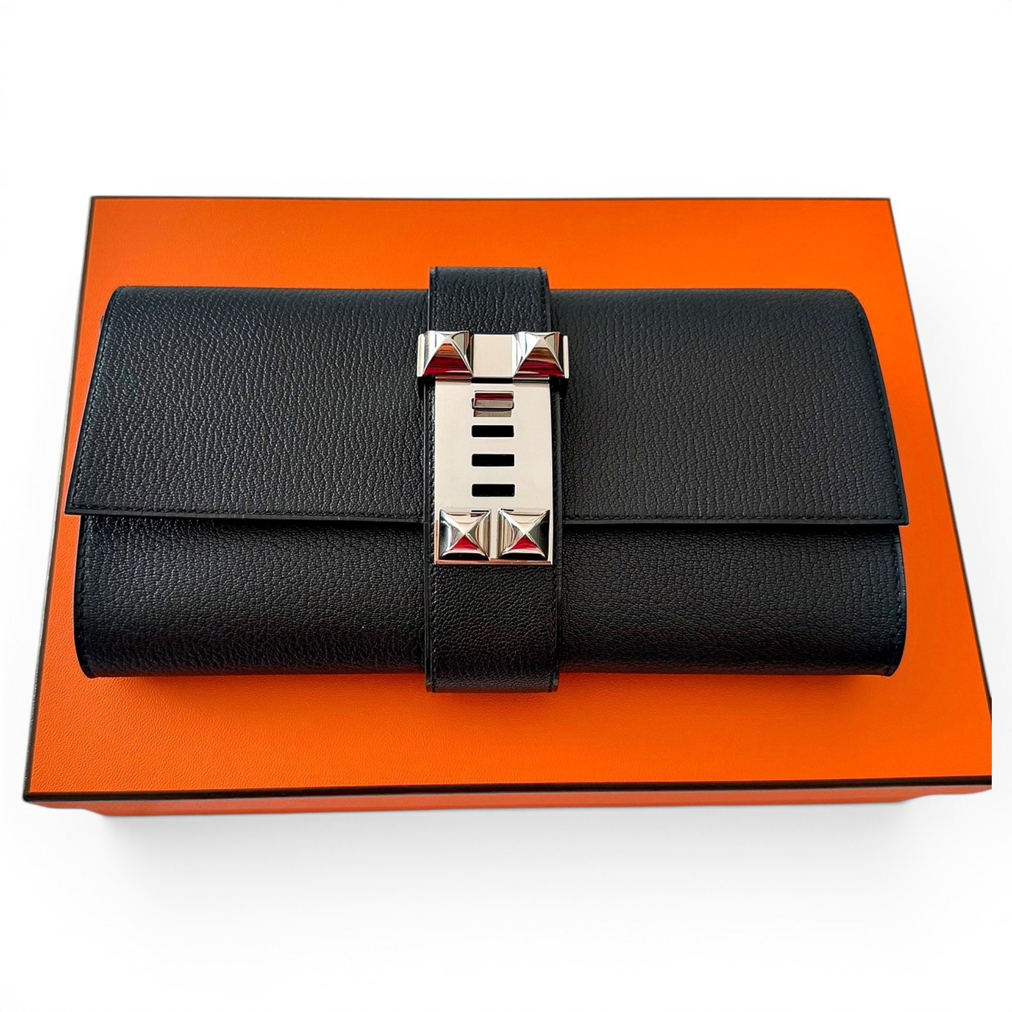 Médor leather clutch bag